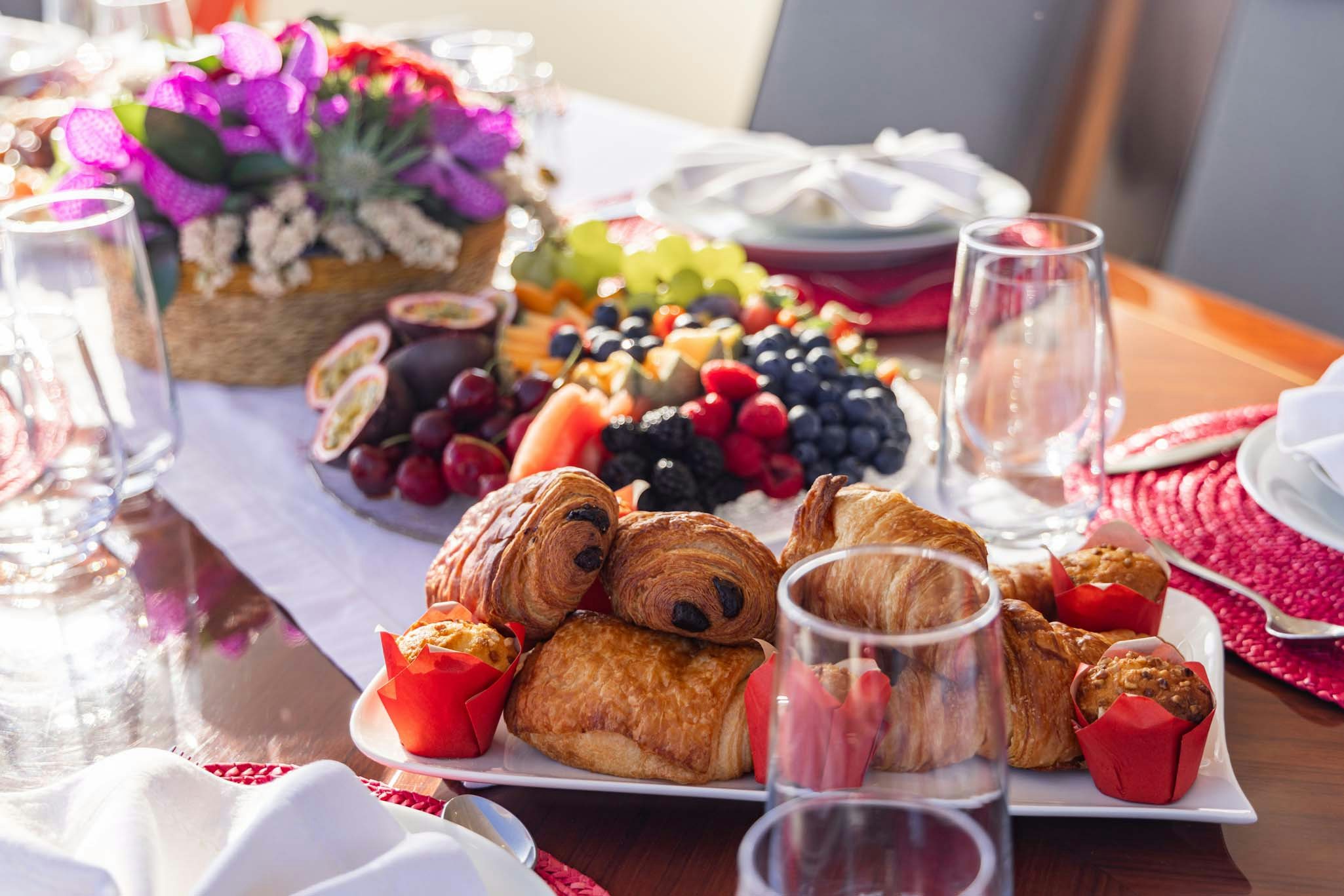 a table with food and glasses aboard VIKING III Yacht for Charter