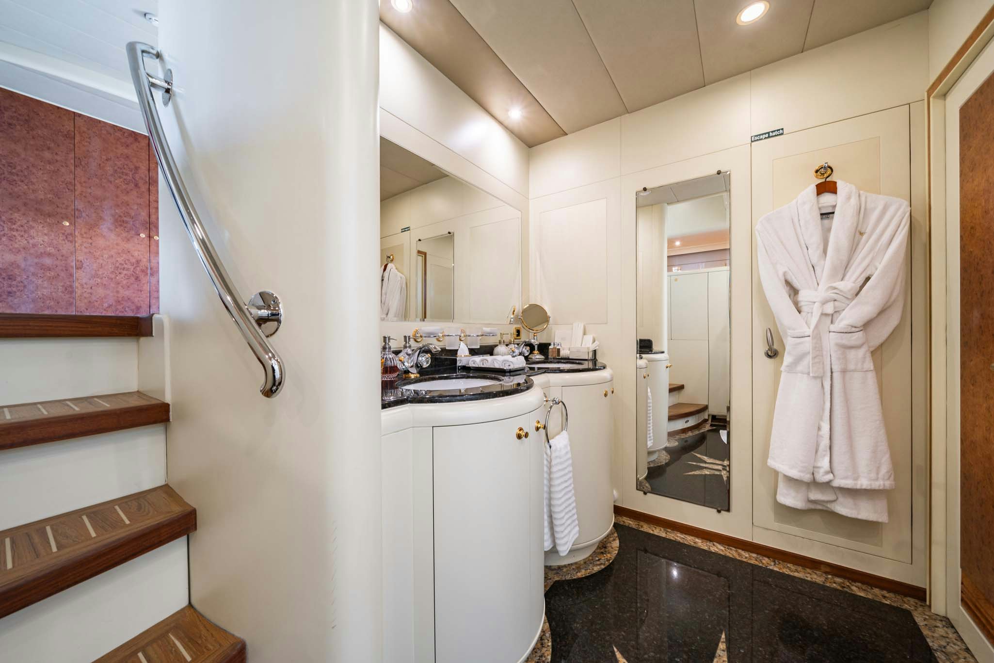 a bathroom with a sink and a mirror aboard VIKING III Yacht for Charter