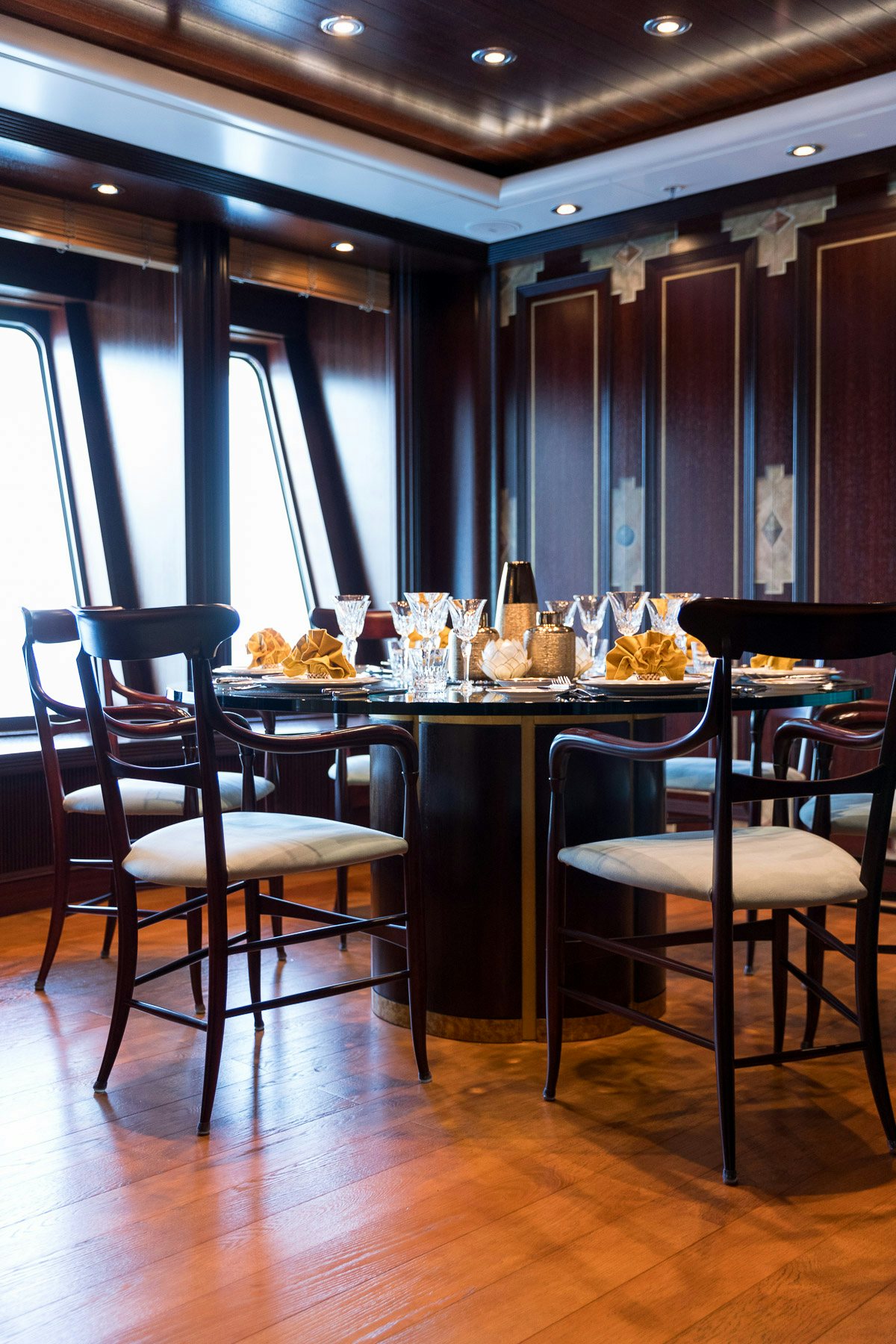 a room with a table and chairs aboard BOADICEA Yacht for Charter