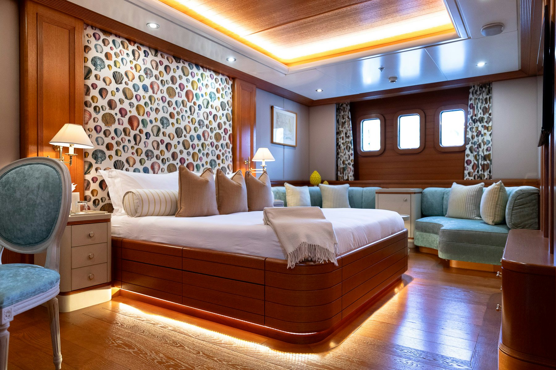 a large bed in a room aboard BOADICEA Yacht for Charter