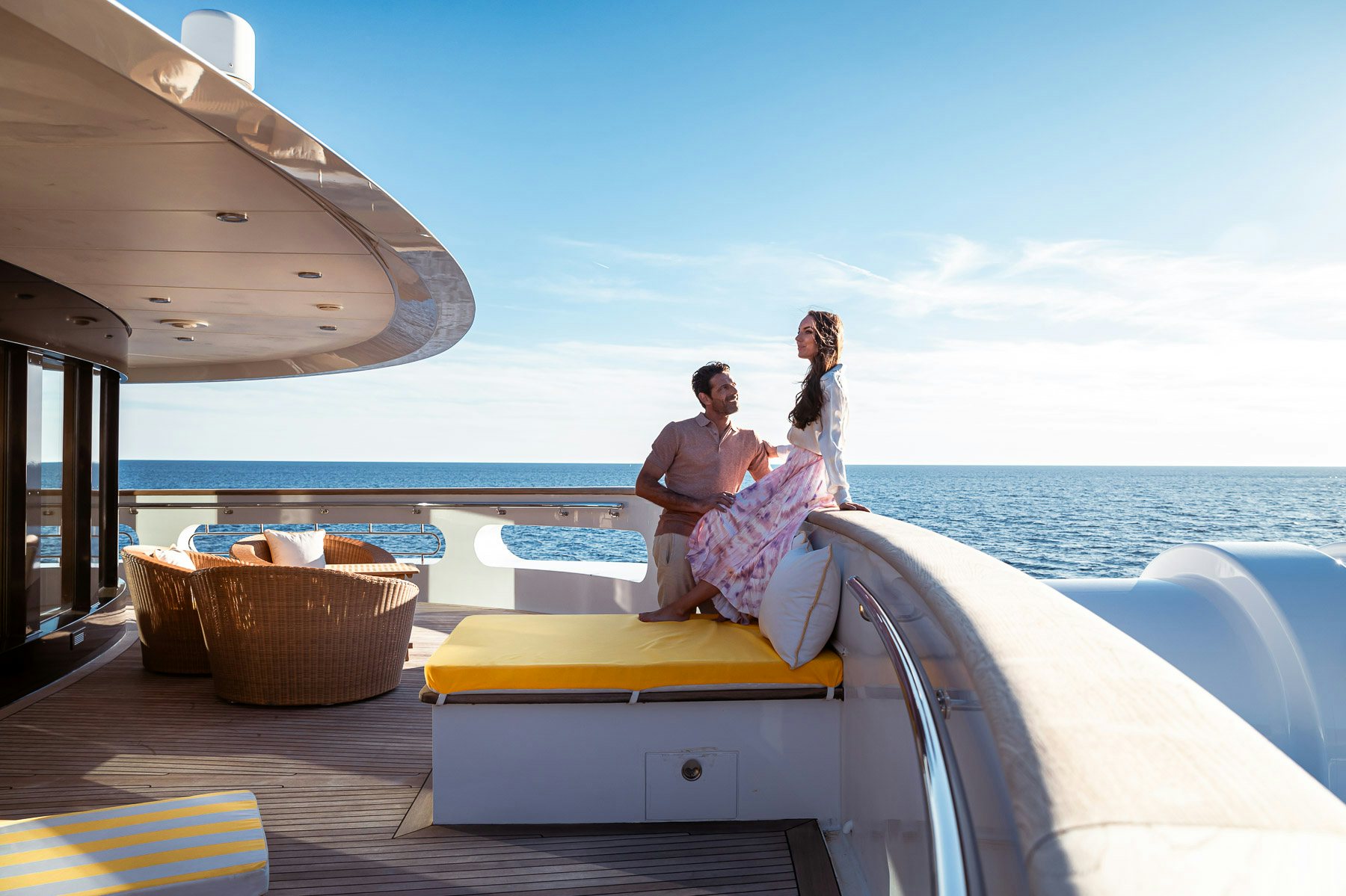 a group of people sitting on a couch on a boat aboard BOADICEA Yacht for Charter