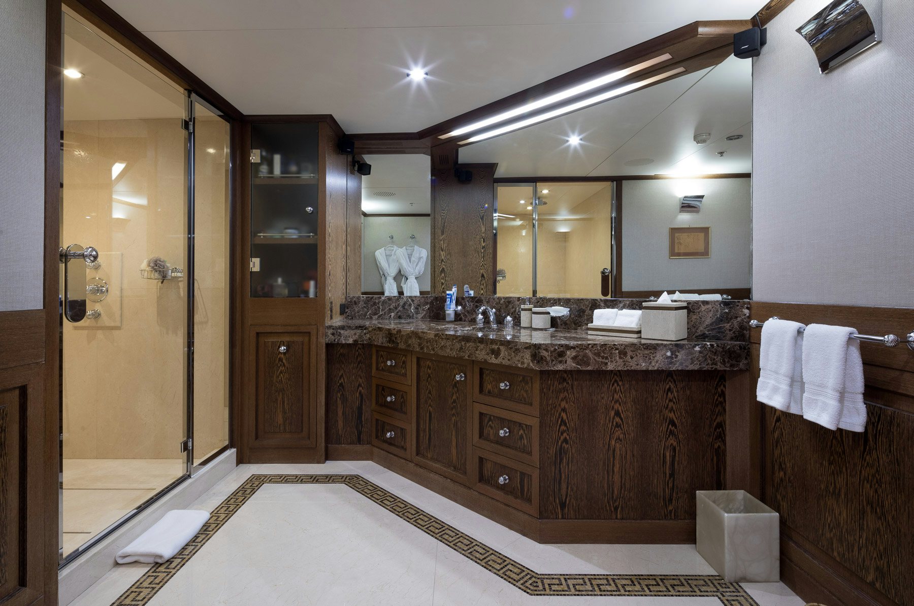 a bathroom with a large mirror aboard BOADICEA Yacht for Charter