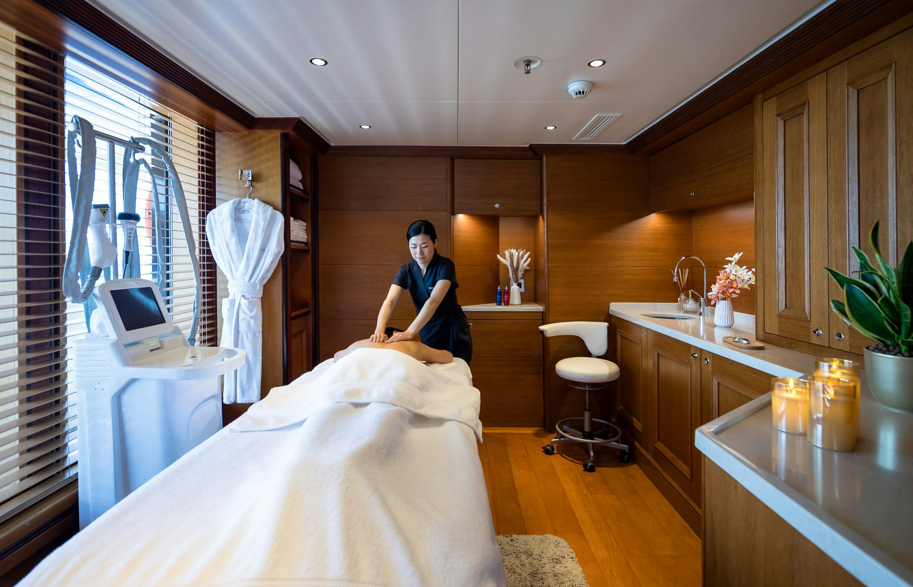 a person in a bathroom aboard BOADICEA Yacht for Charter