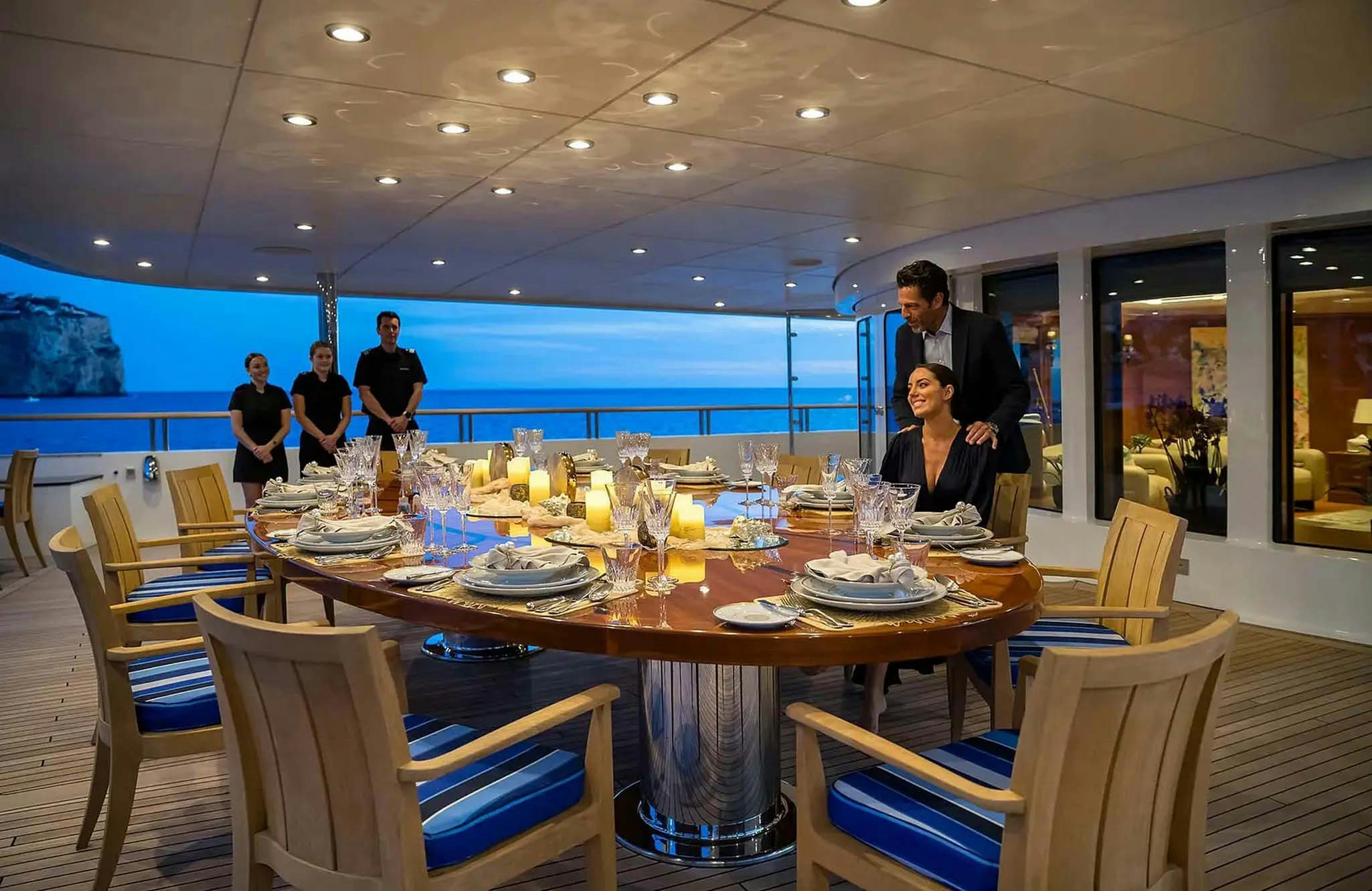 a table set for a dinner party aboard BOADICEA Yacht for Charter