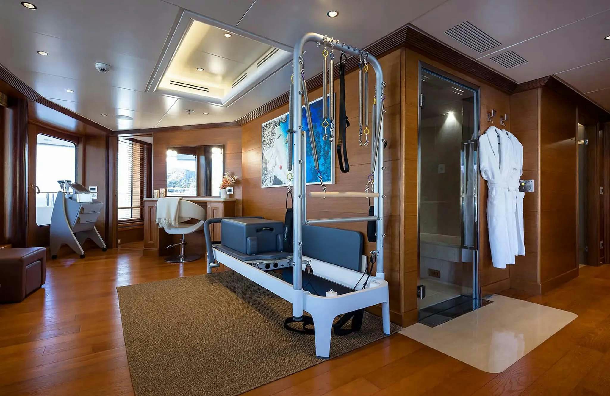 a large room with a bed and a chair aboard BOADICEA Yacht for Charter