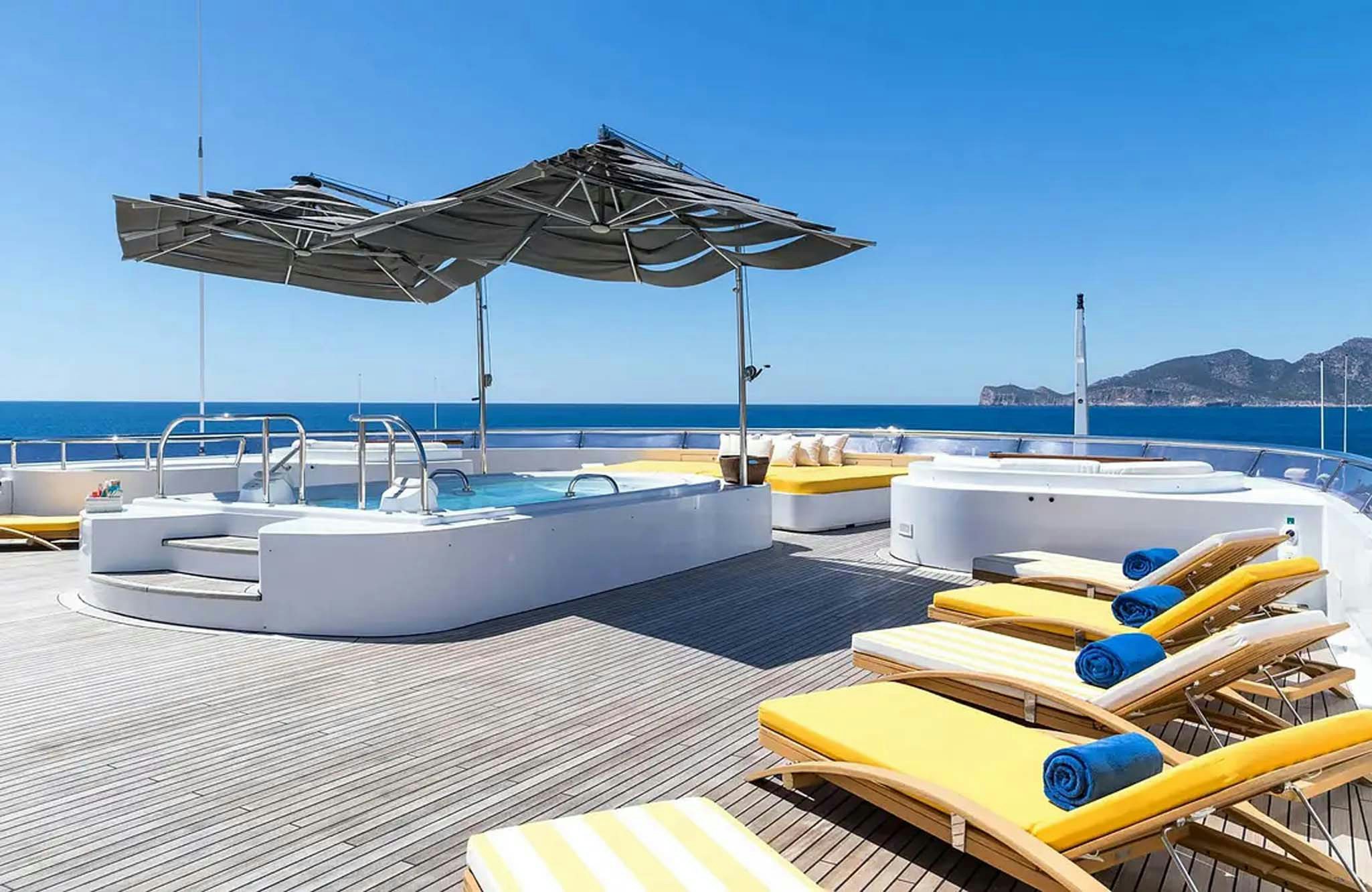 a boat is parked under an umbrella aboard BOADICEA Yacht for Charter