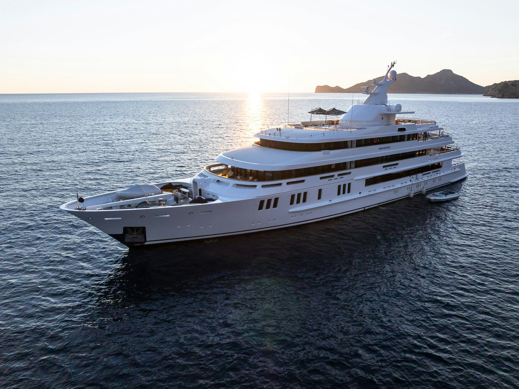 a white boat on the water aboard BOADICEA Yacht for Charter