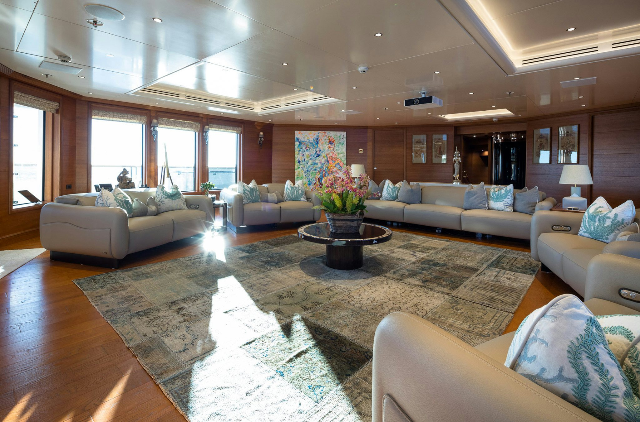a living room with a large rug aboard BOADICEA Yacht for Charter