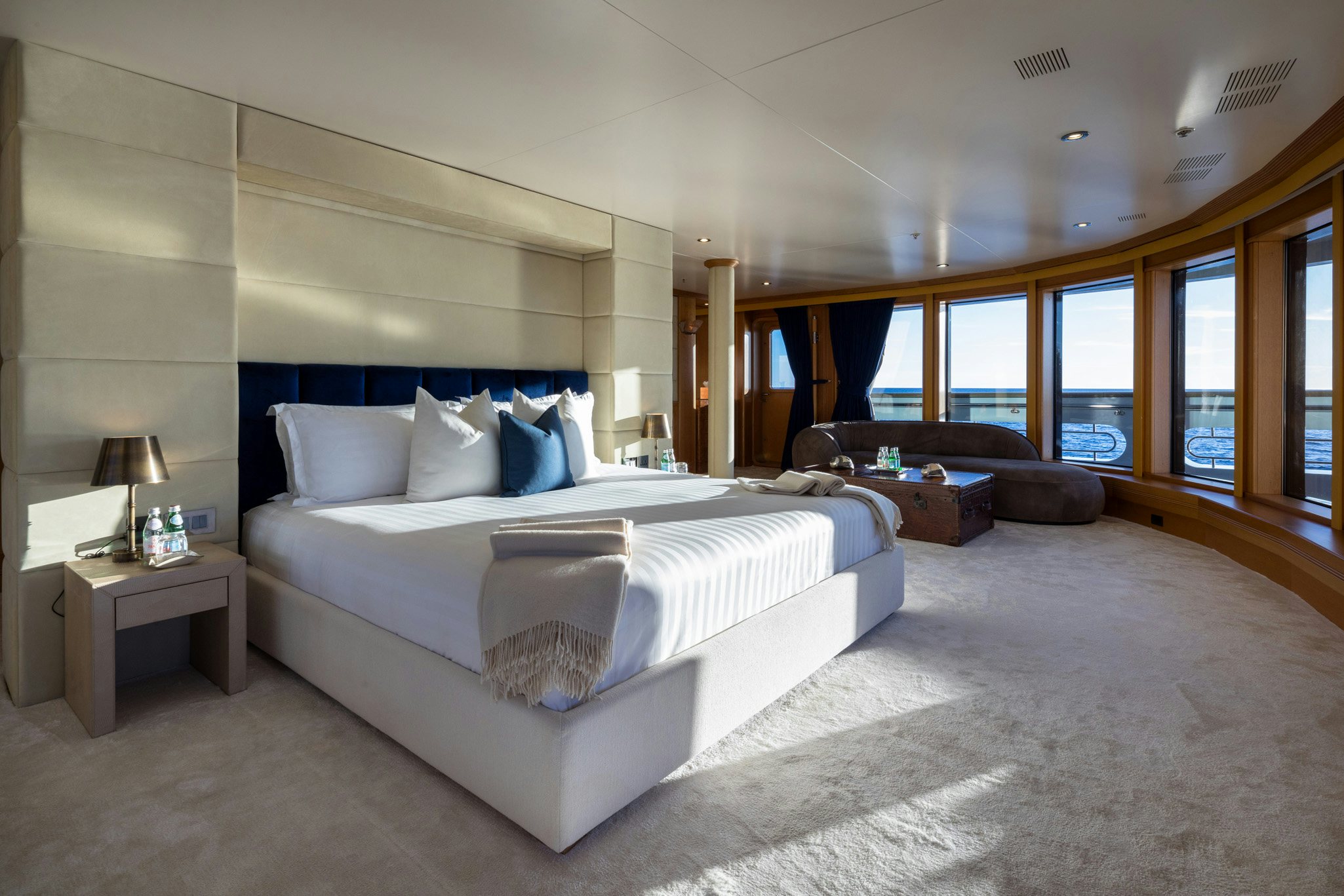 a large bedroom with a large bed aboard BOADICEA Yacht for Charter