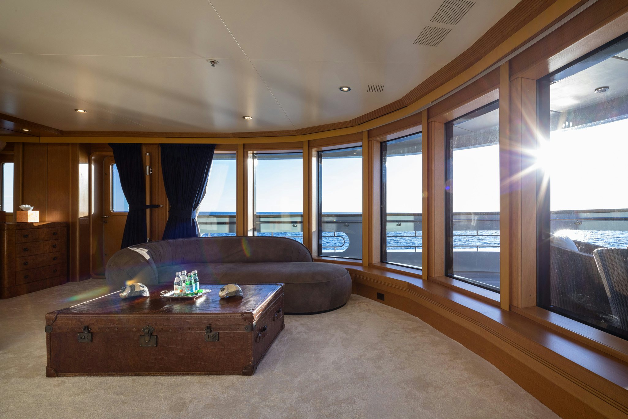 a living room with a couch and a table aboard BOADICEA Yacht for Charter