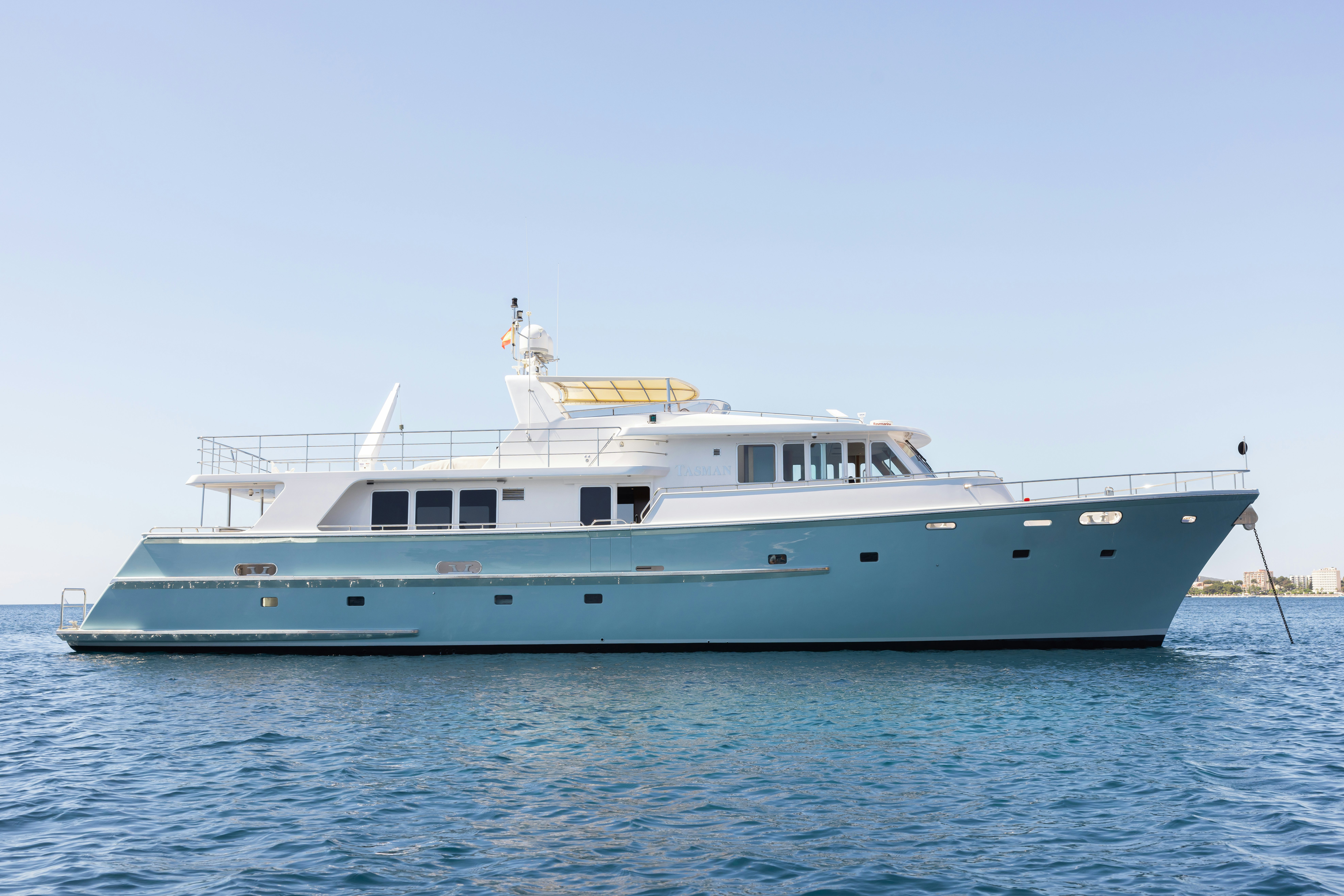 a large boat in the water aboard TASMAN Yacht for Sale