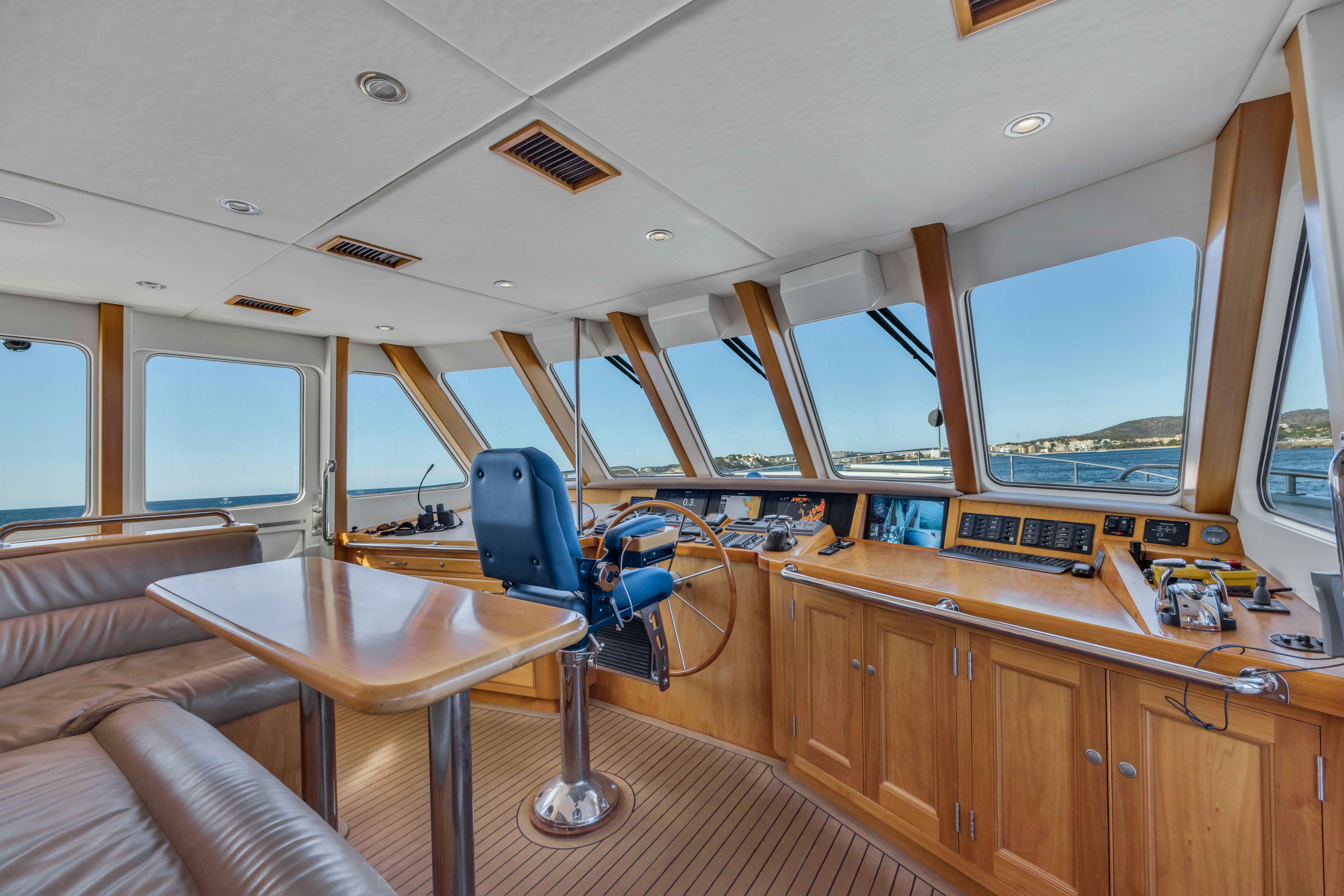 a room with a desk and a chair aboard TASMAN Yacht for Sale