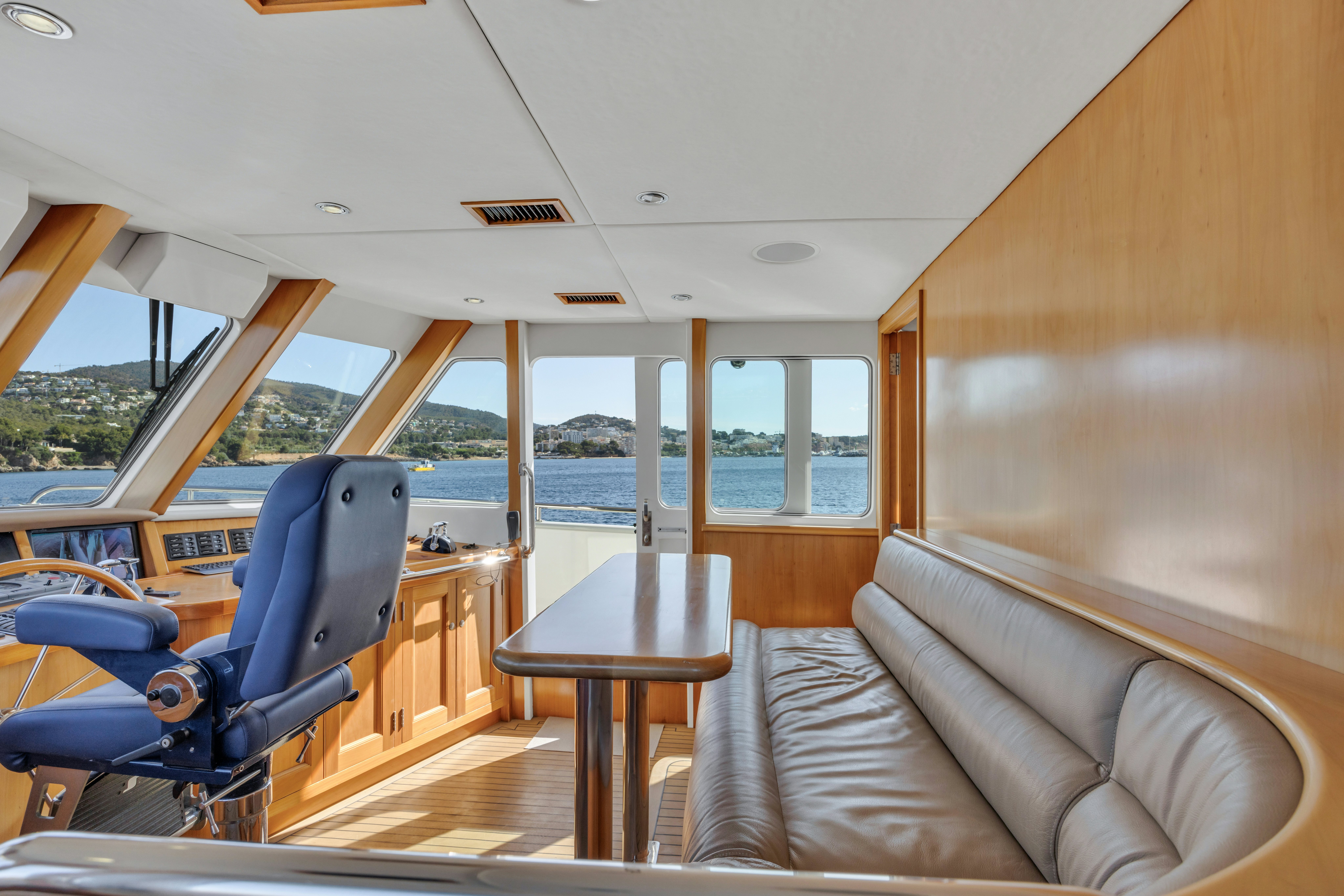 a living room with a couch and a table aboard TASMAN Yacht for Sale
