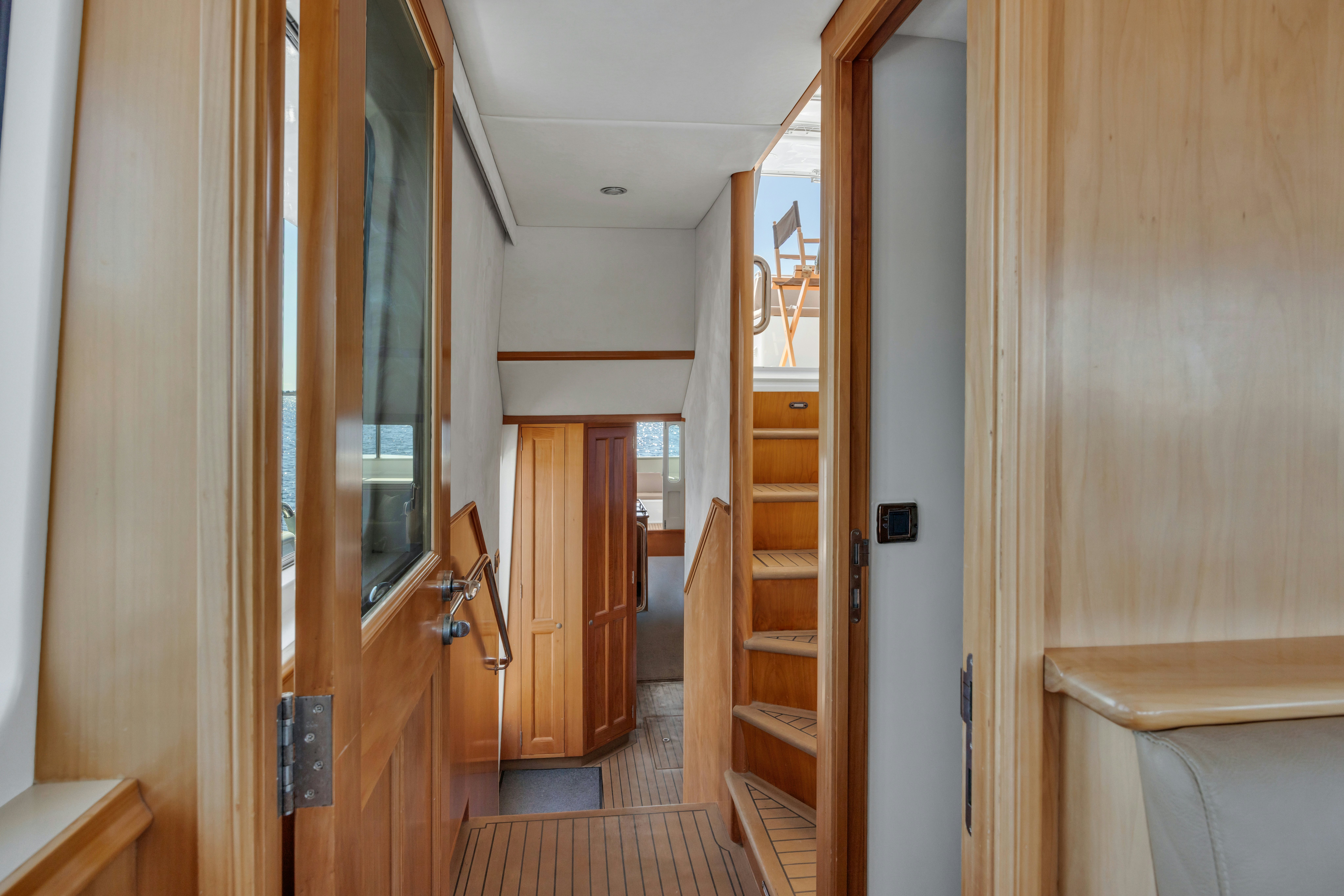 a hallway with wooden doors aboard TASMAN Yacht for Sale