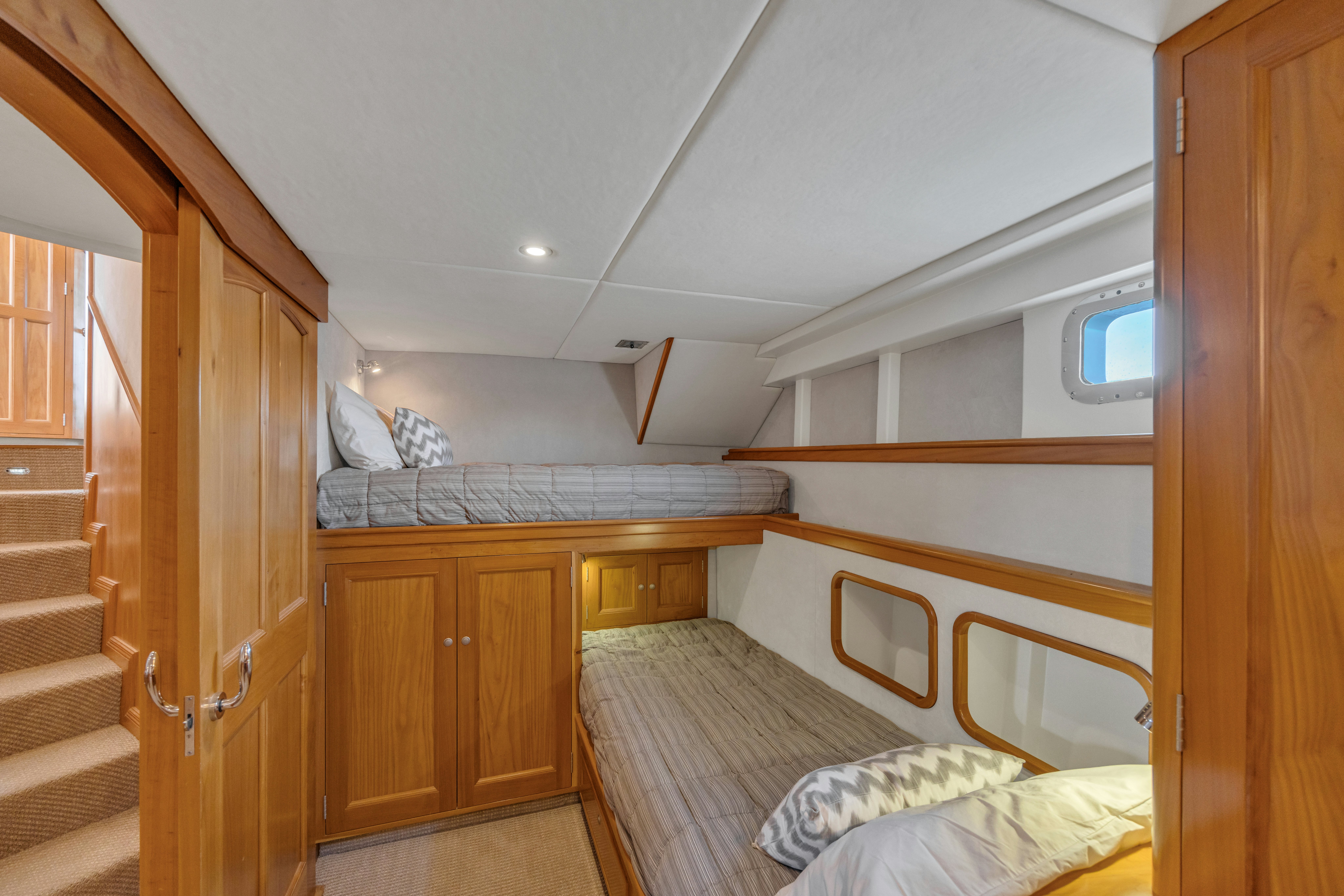a bedroom with a bed and a closet aboard TASMAN Yacht for Sale