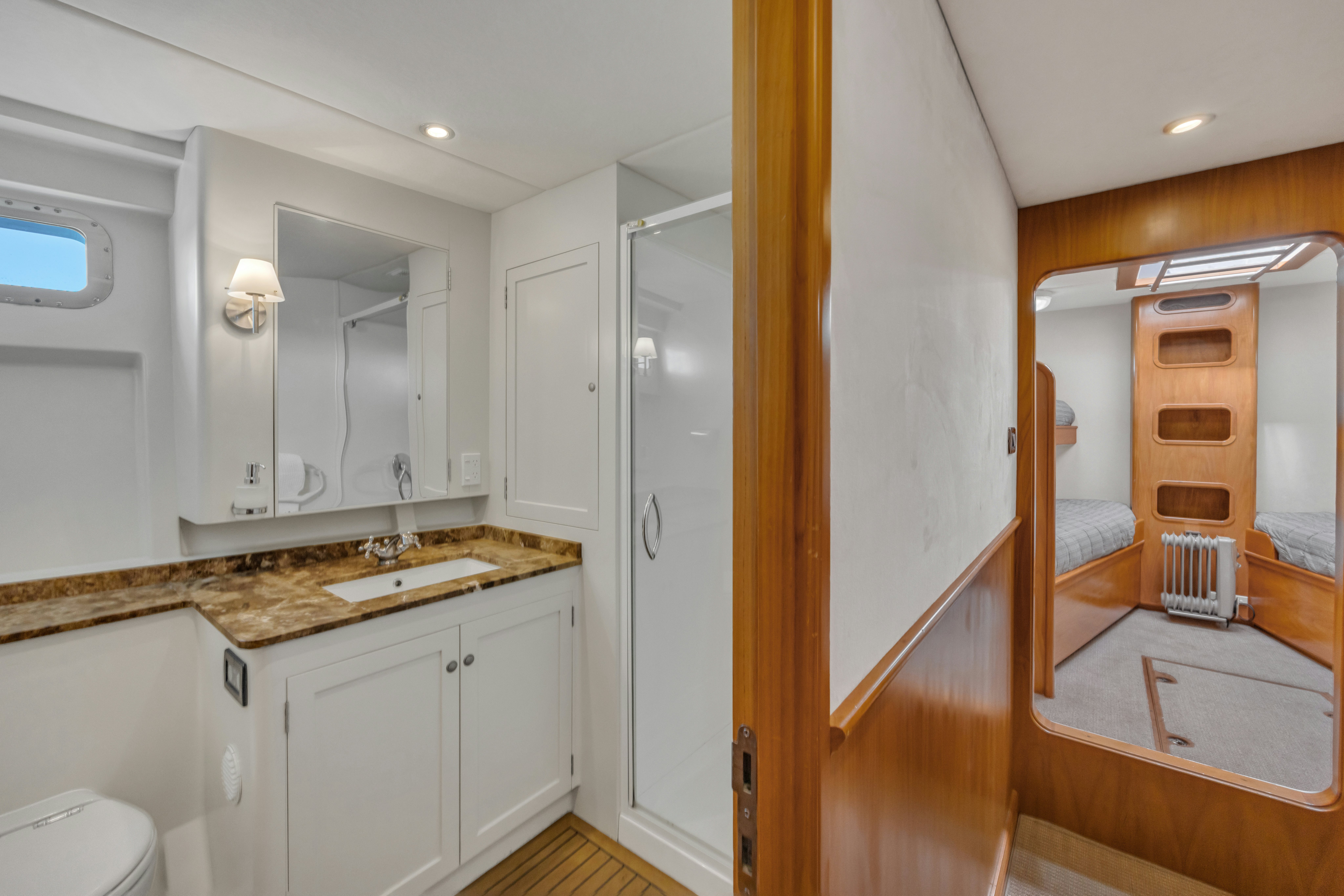 a bathroom with a sink and a mirror aboard TASMAN Yacht for Sale
