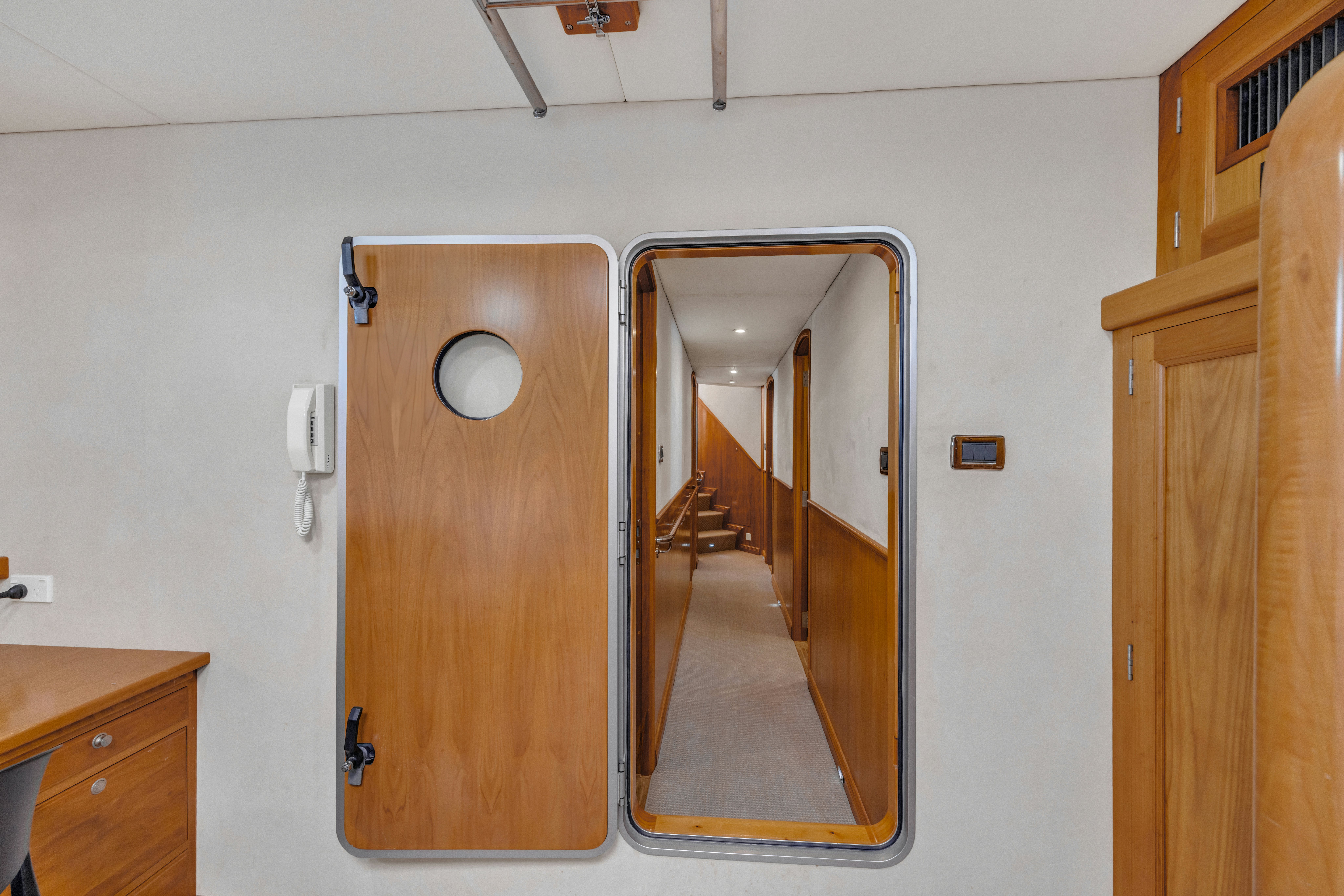 a room with a mirror and a door aboard TASMAN Yacht for Sale