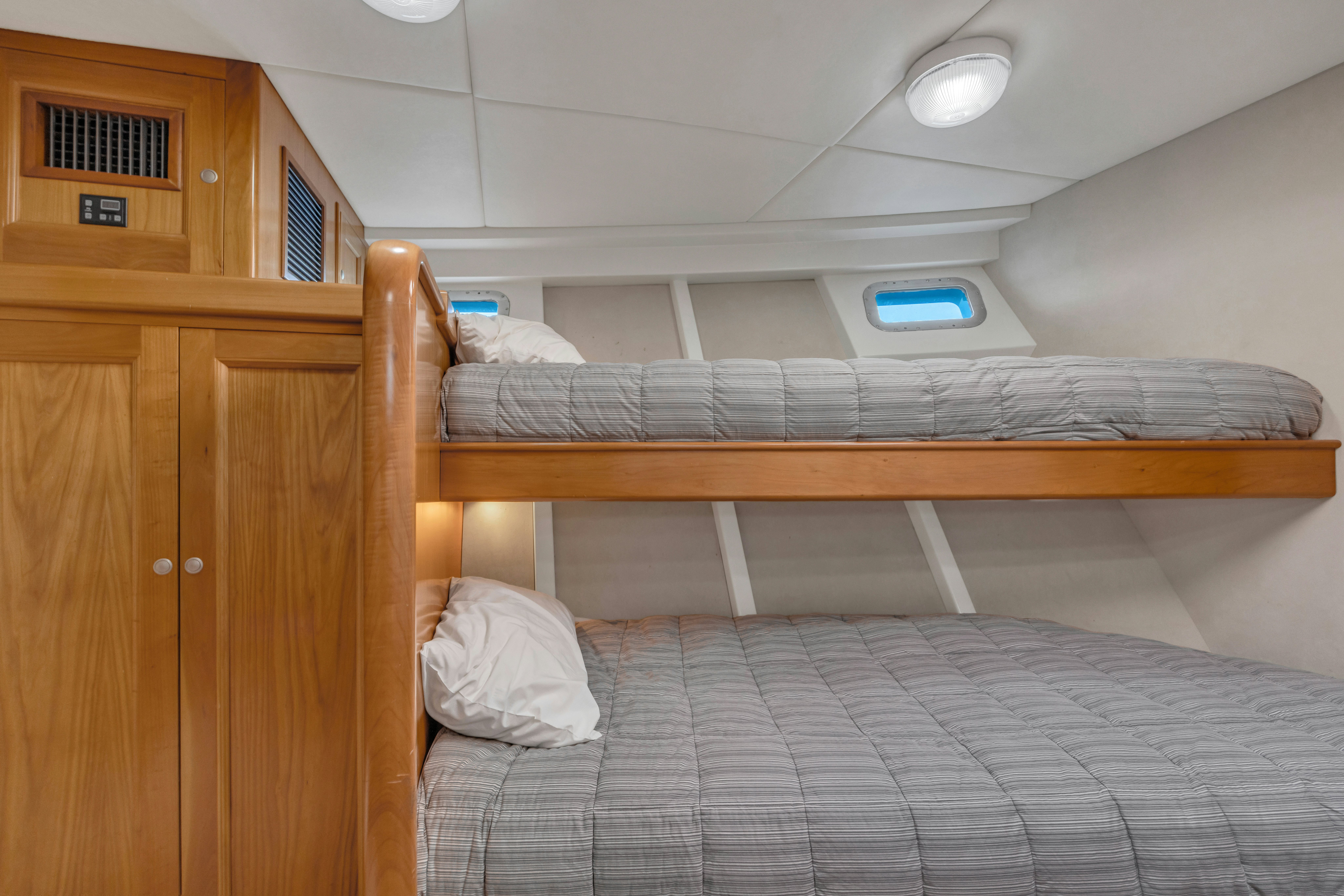 a couple of beds in a room aboard TASMAN Yacht for Sale