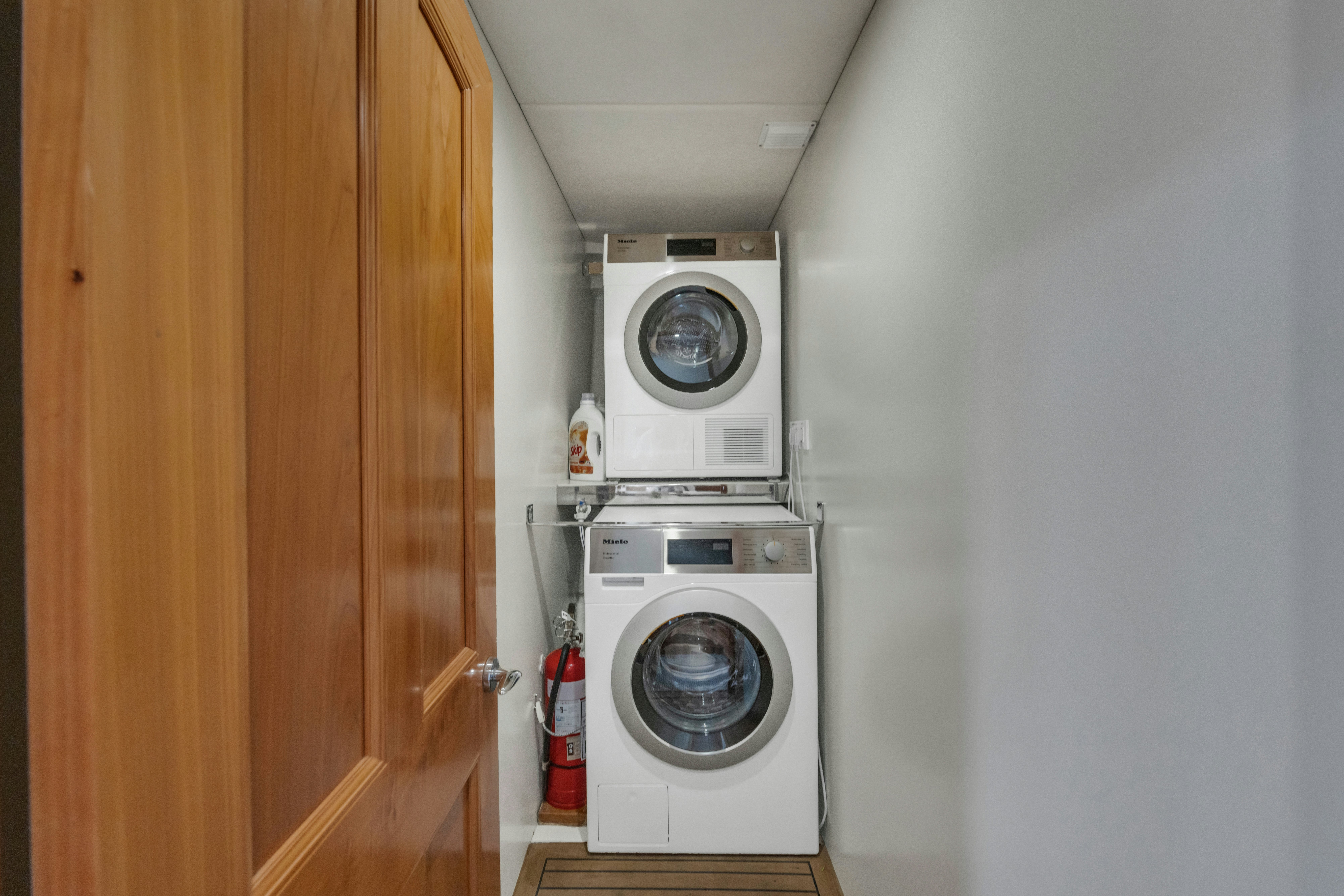 a white washing machine aboard TASMAN Yacht for Sale
