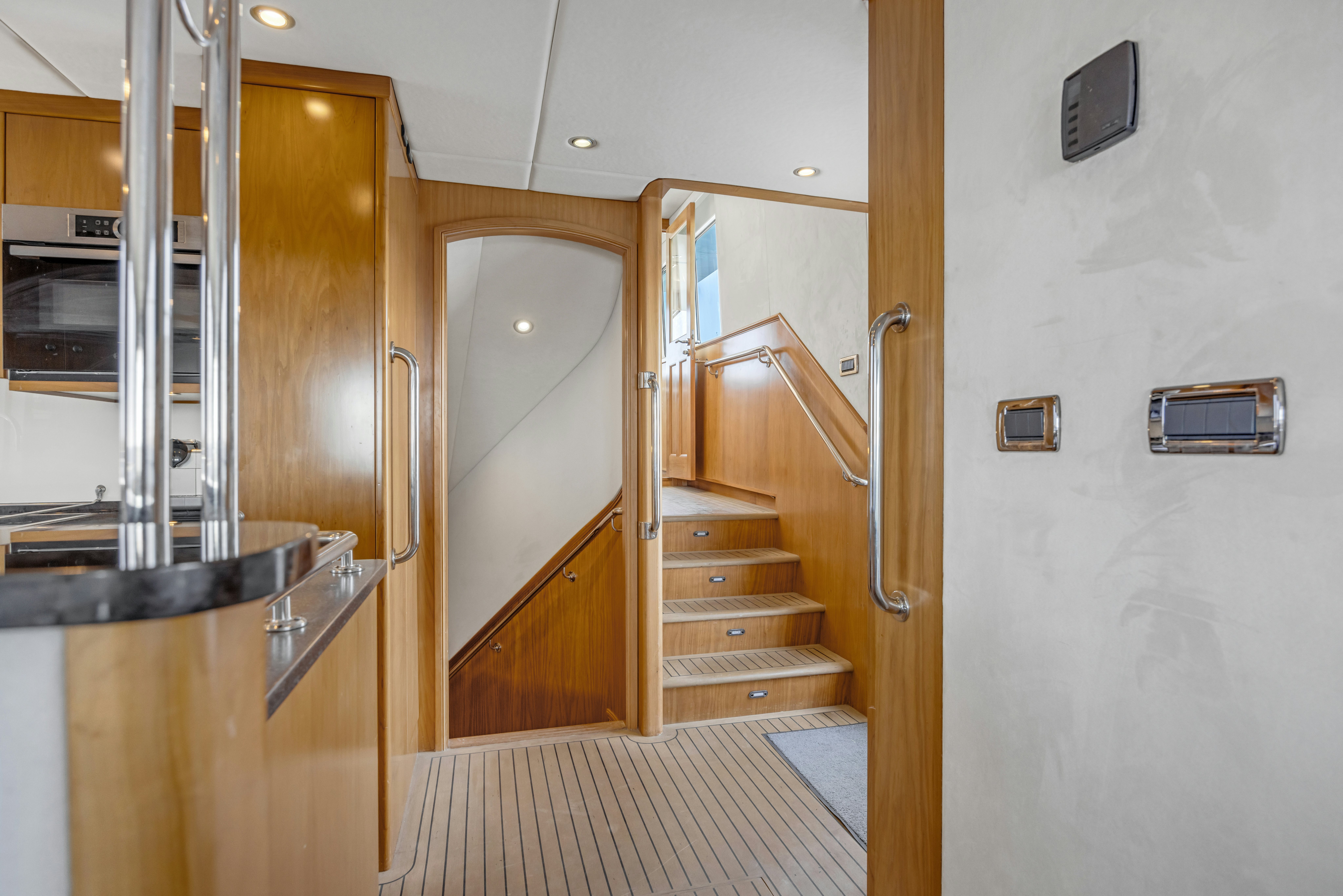 a room with a staircase and a door aboard TASMAN Yacht for Sale