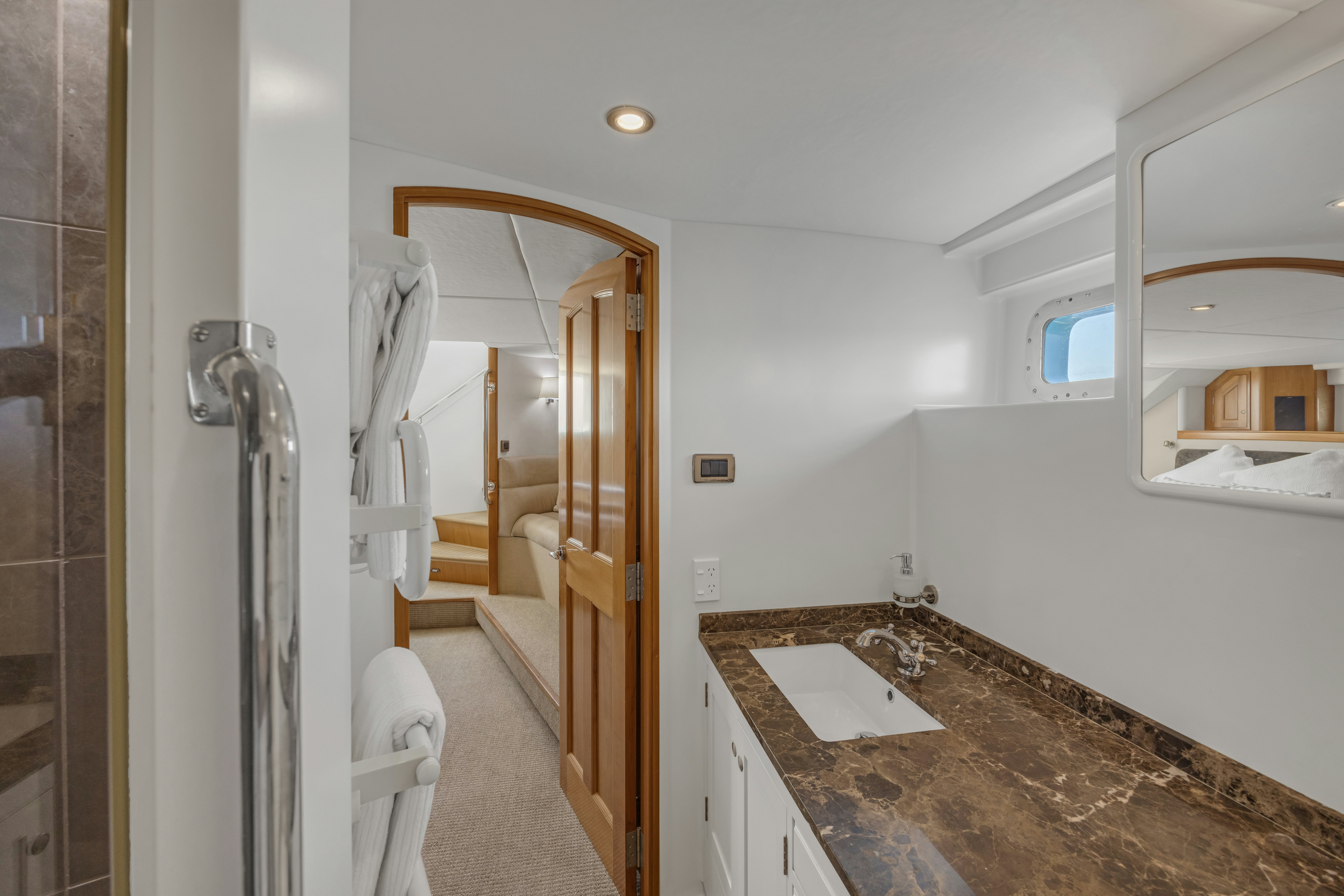 a bathroom with a marble countertop aboard TASMAN Yacht for Sale