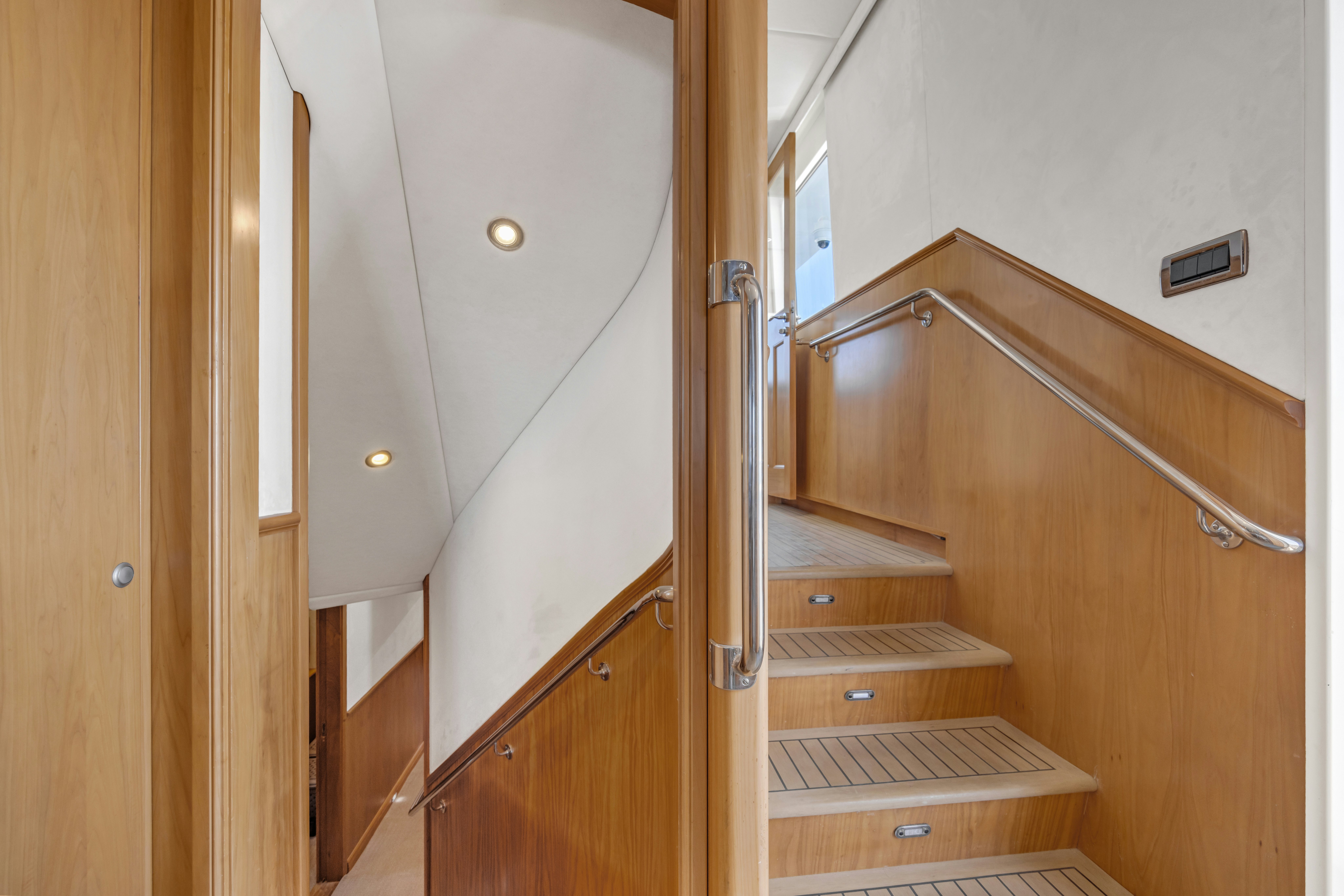 a room with wooden cabinets and a white wall aboard TASMAN Yacht for Sale