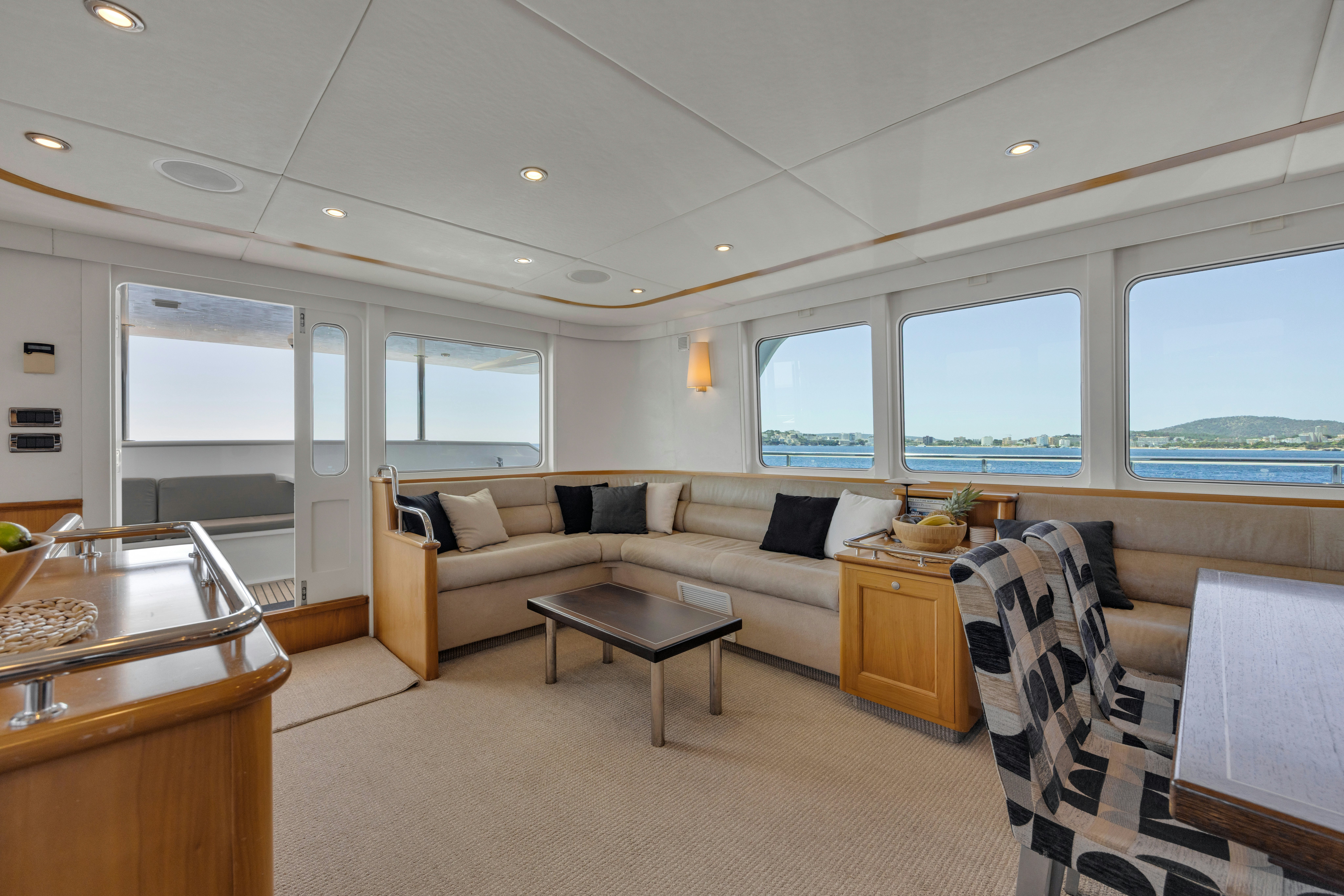a living room with a couch and a table aboard TASMAN Yacht for Sale