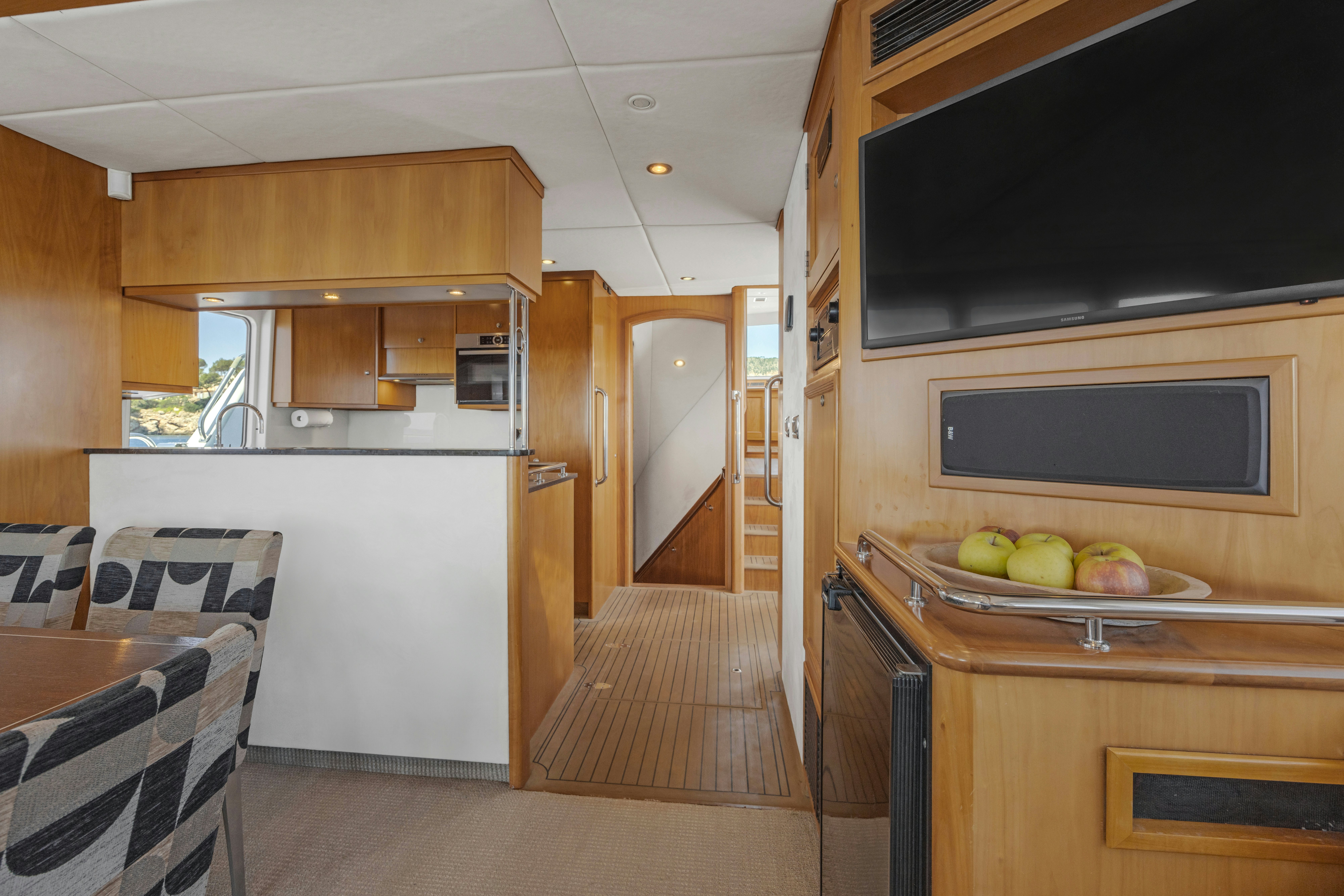 a kitchen with a microwave oven and a table aboard TASMAN Yacht for Sale