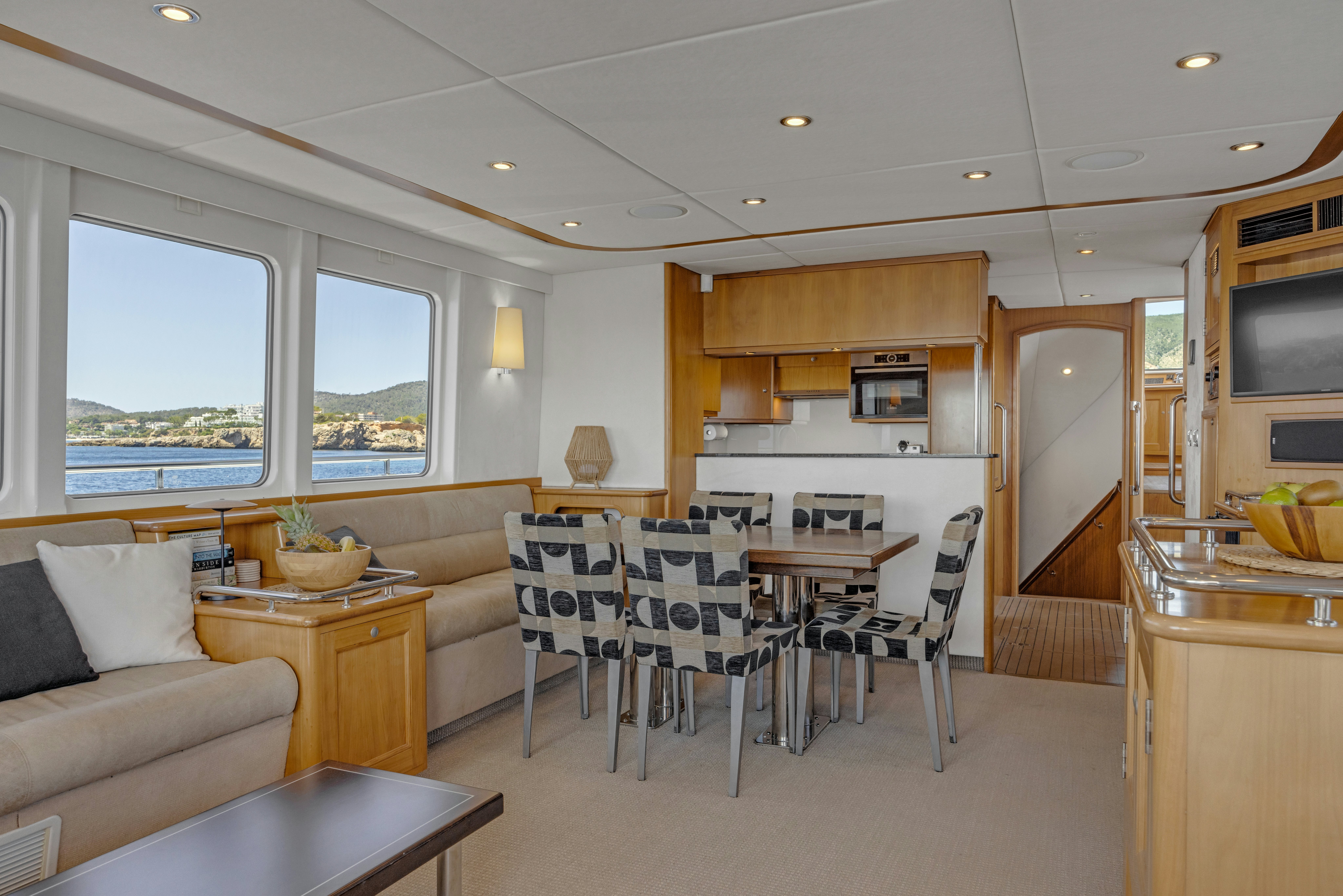 a kitchen and dining area aboard TASMAN Yacht for Sale