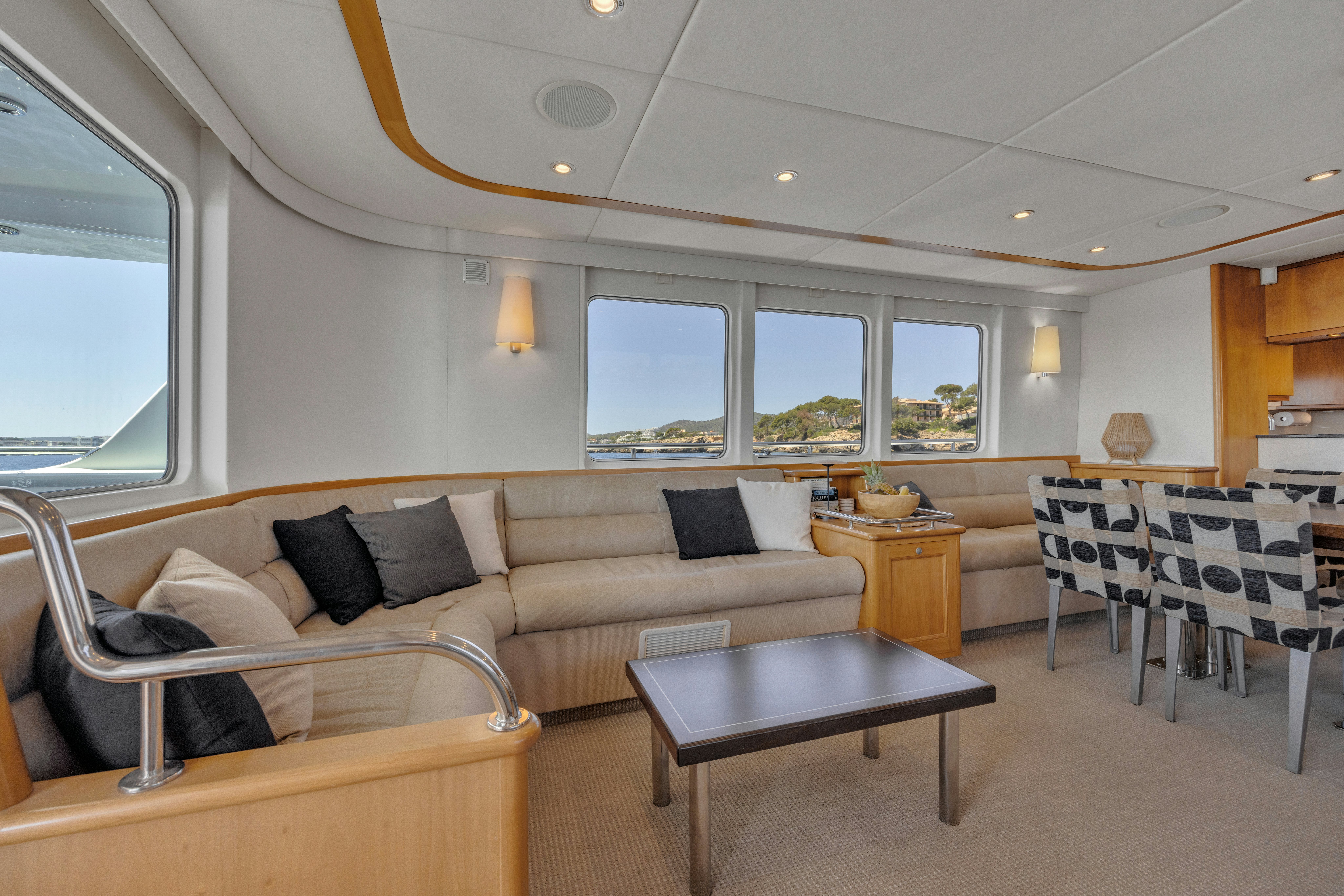 a living room with a couch and a table aboard TASMAN Yacht for Sale