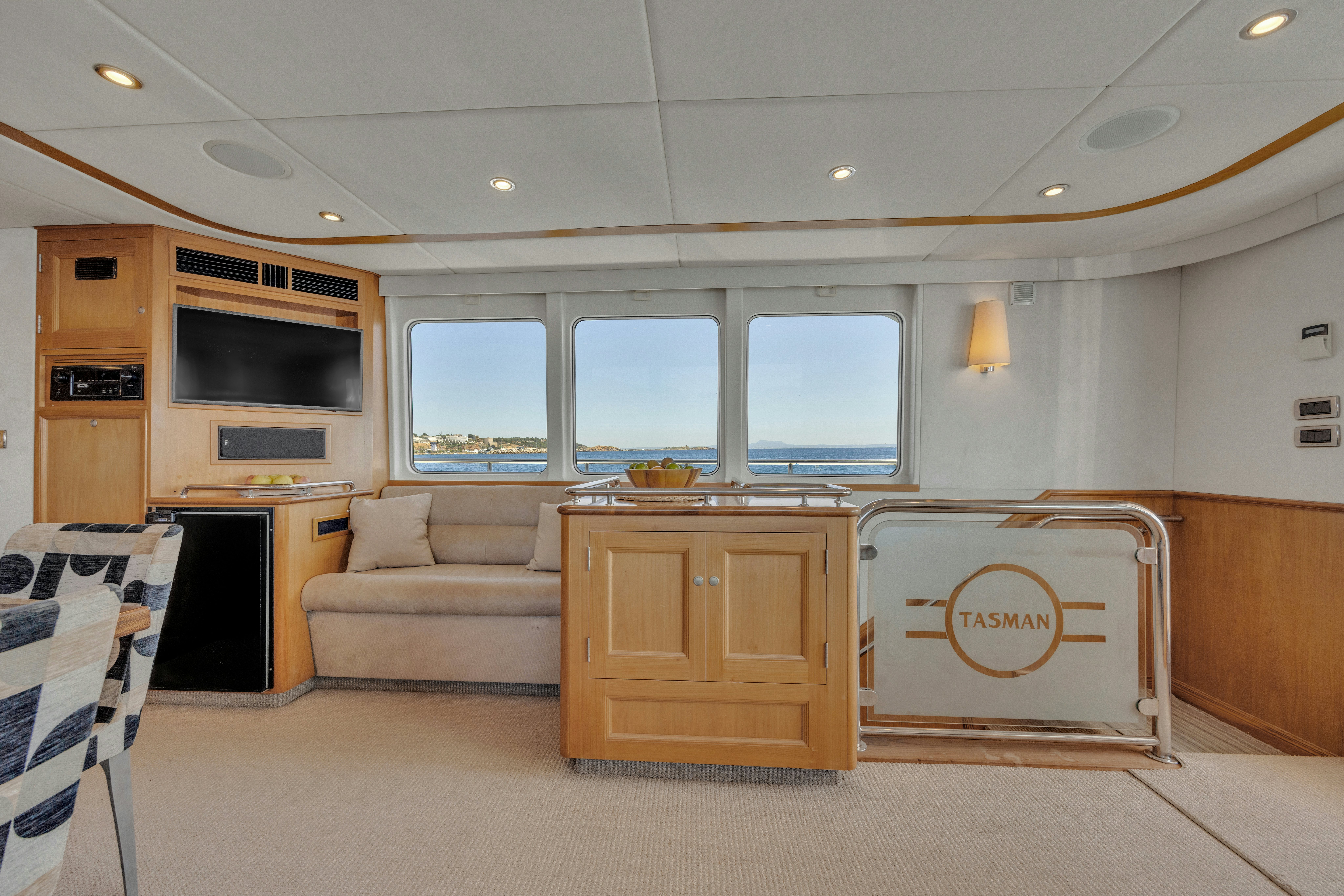 a living room with a couch and a tv aboard TASMAN Yacht for Sale