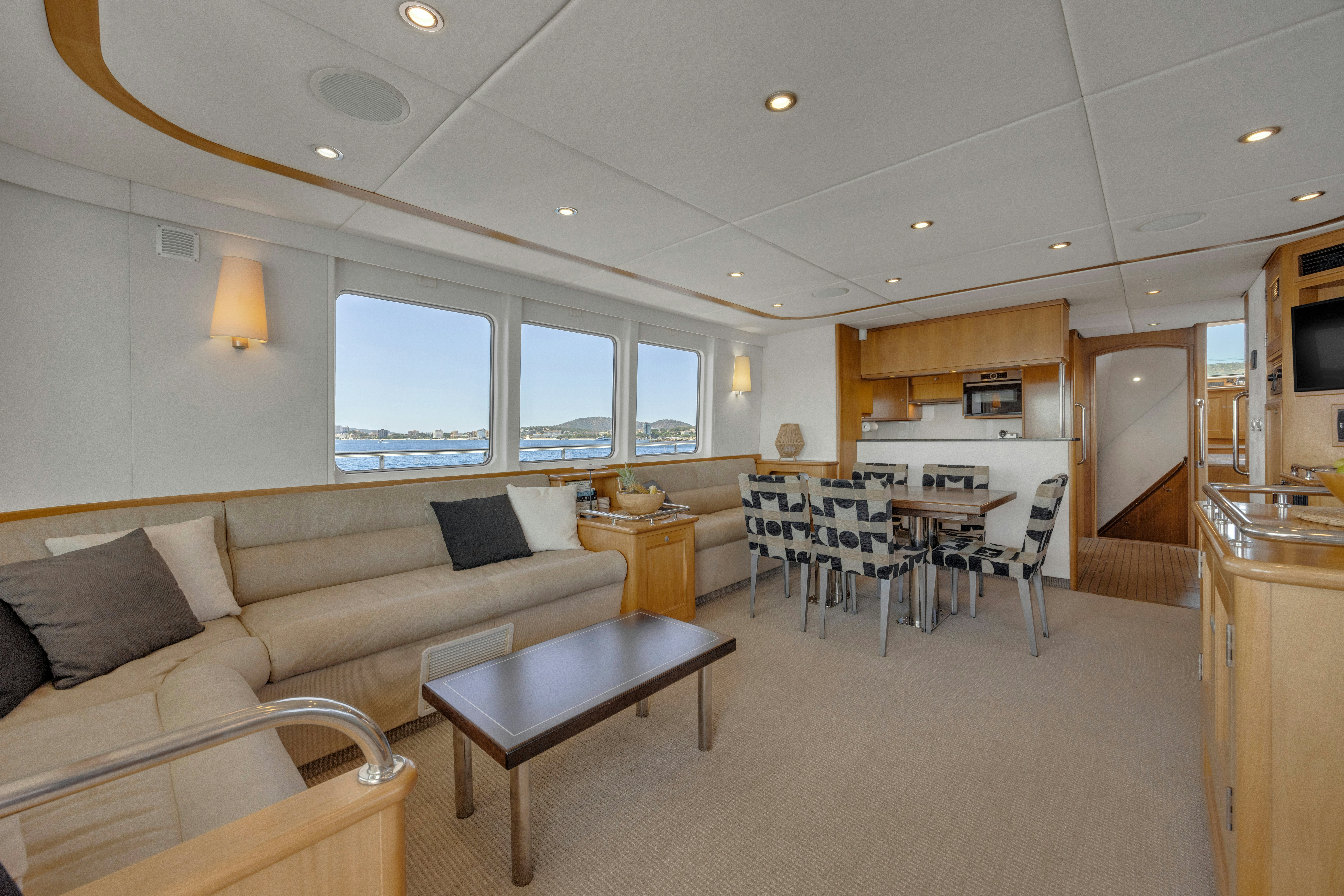 a living room with a couch and a table aboard TASMAN Yacht for Sale