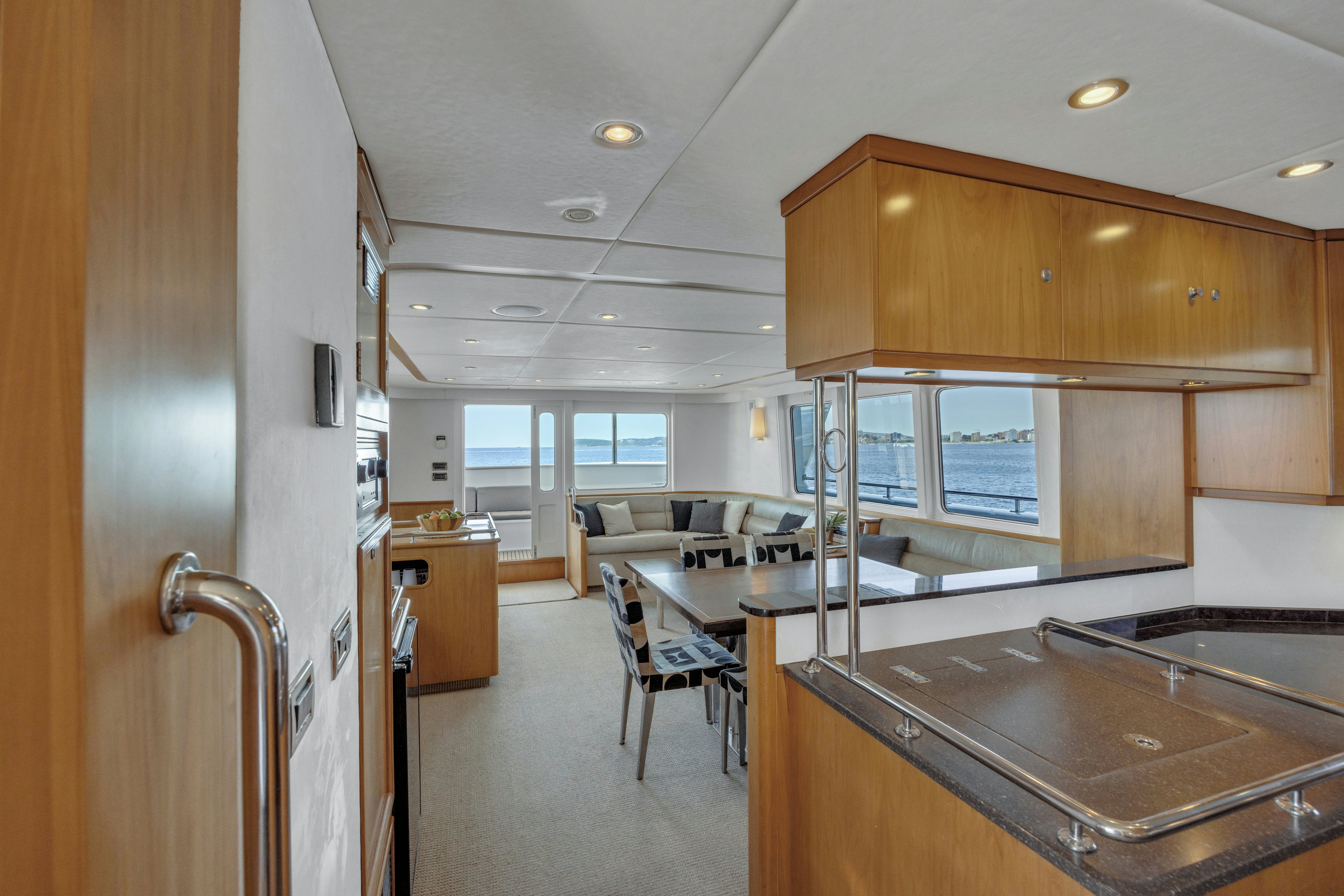 a kitchen and dining area aboard TASMAN Yacht for Sale