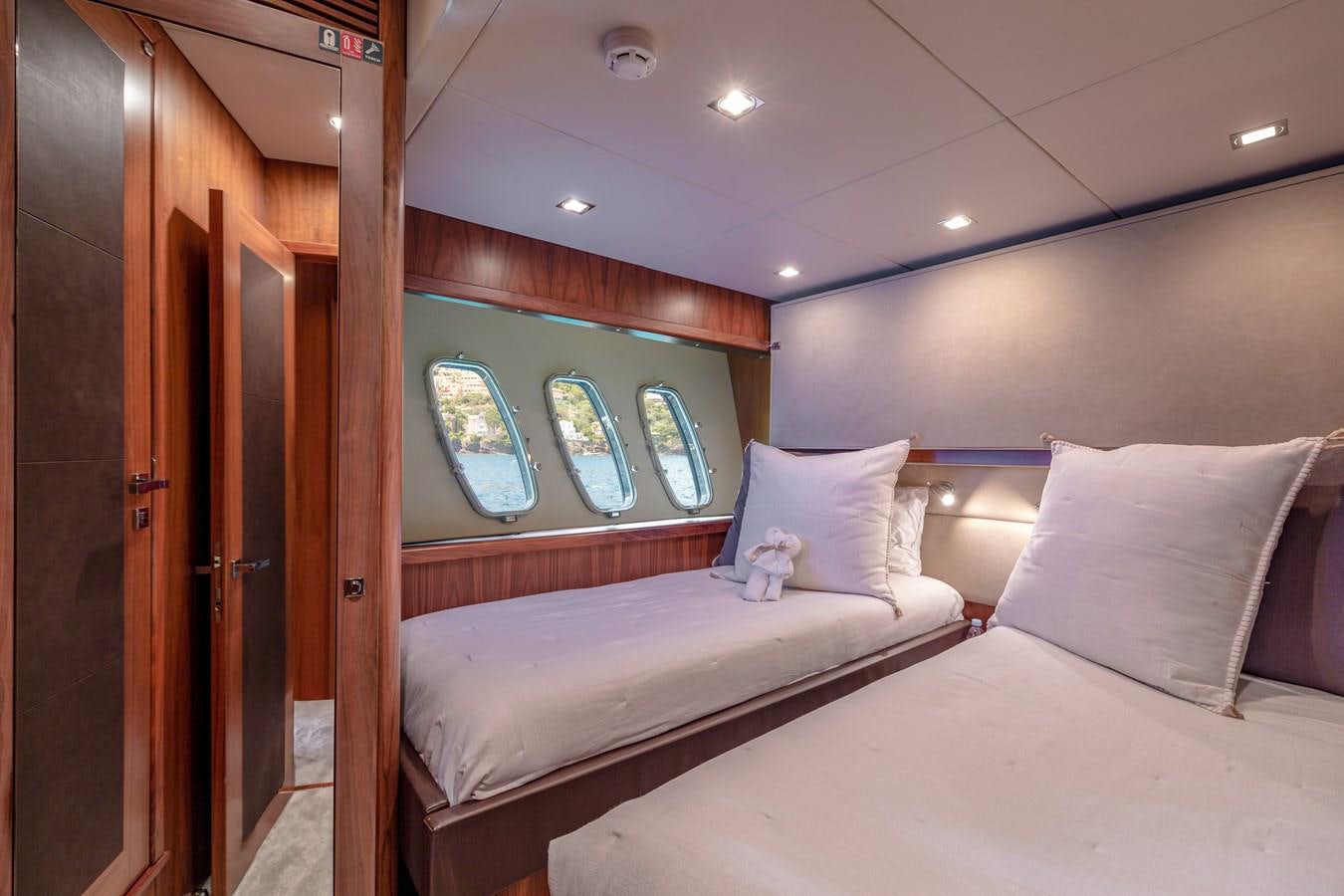 a room with two beds aboard MR SEA Yacht for Sale