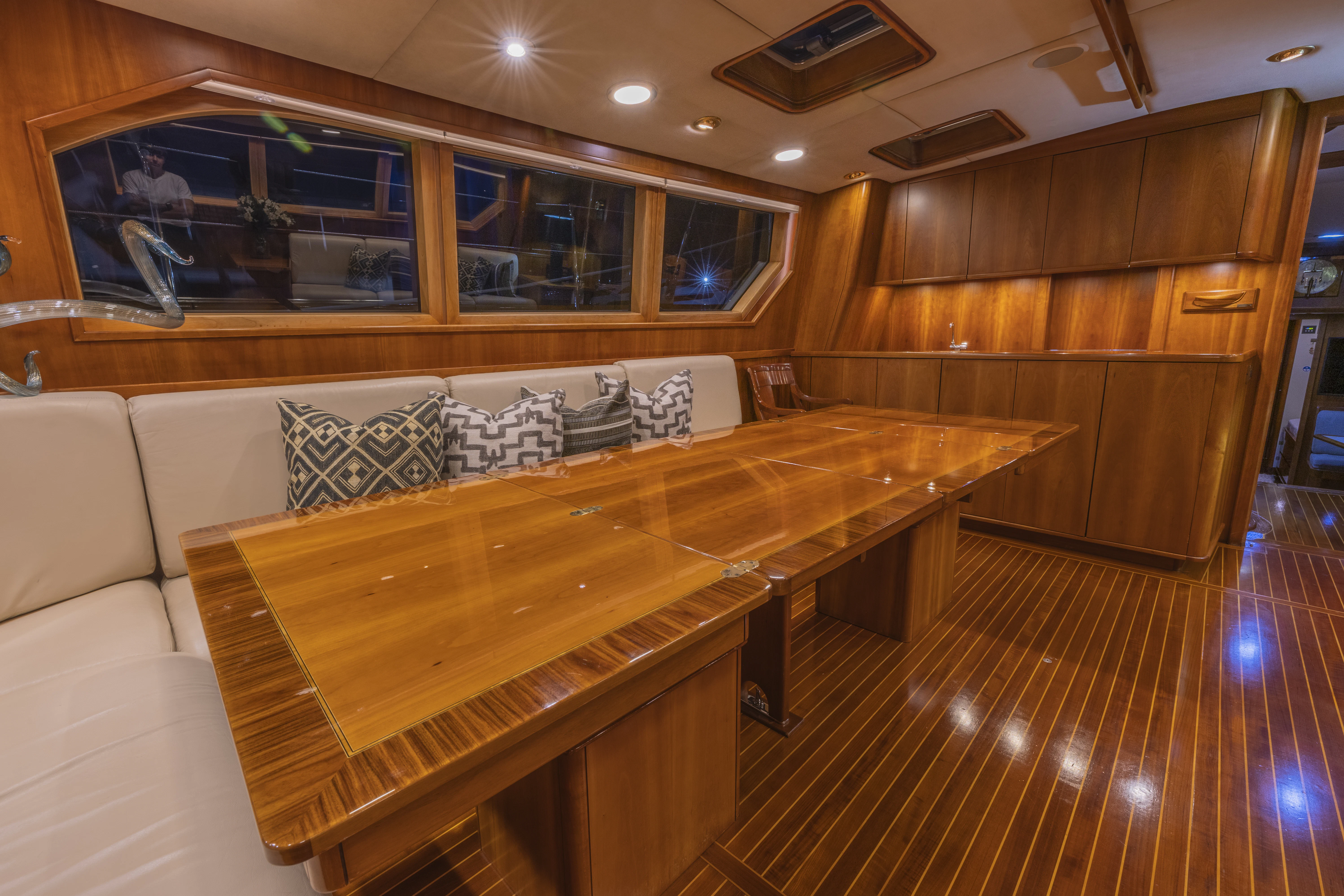 a room with a table and couch aboard ALTAIR Yacht for Sale