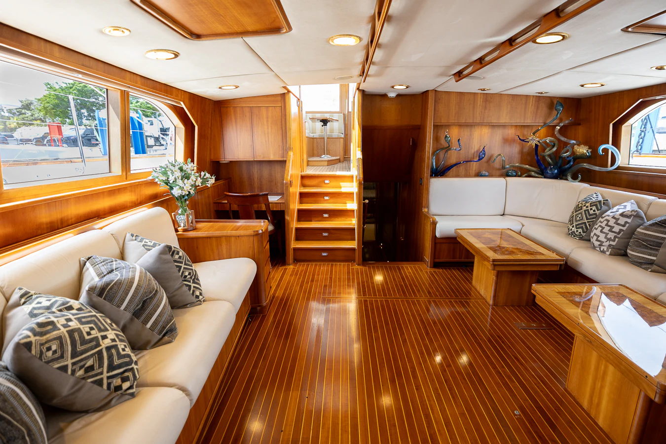 a living room with a large wood floor and a wood floor aboard ALTAIR Yacht for Sale