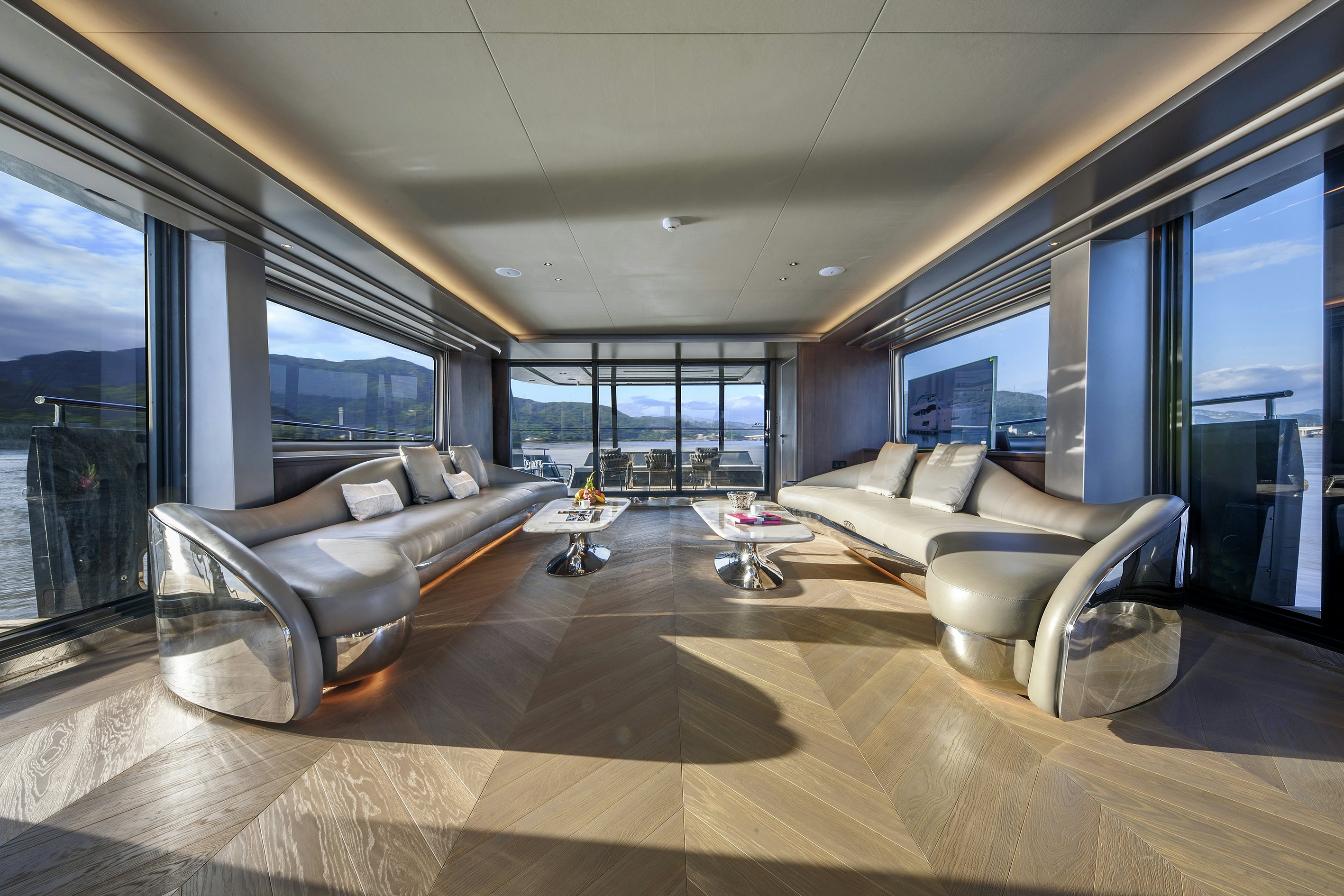 a living room with a large window aboard ALLEGRO FLYBRIDGE 98 Yacht for Sale