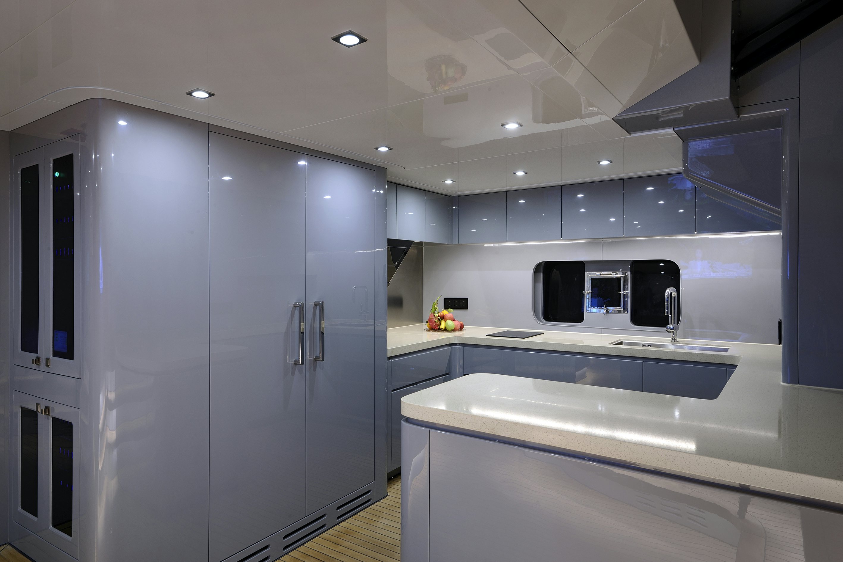 a kitchen with white cabinets aboard ALLEGRO FLYBRIDGE 98 Yacht for Sale