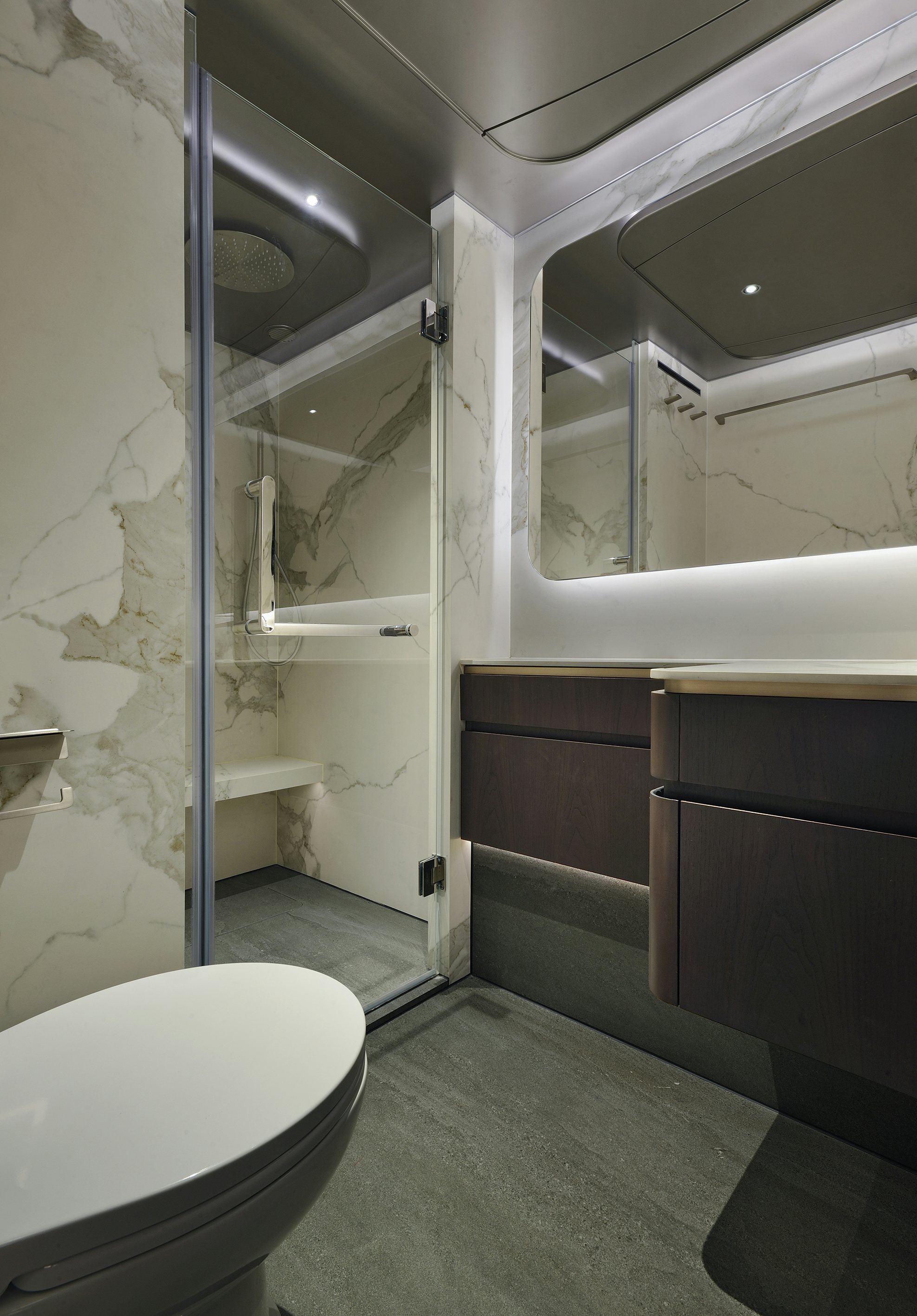 a bathroom with a toilet and a bathtub aboard ALLEGRO FLYBRIDGE 98 Yacht for Sale
