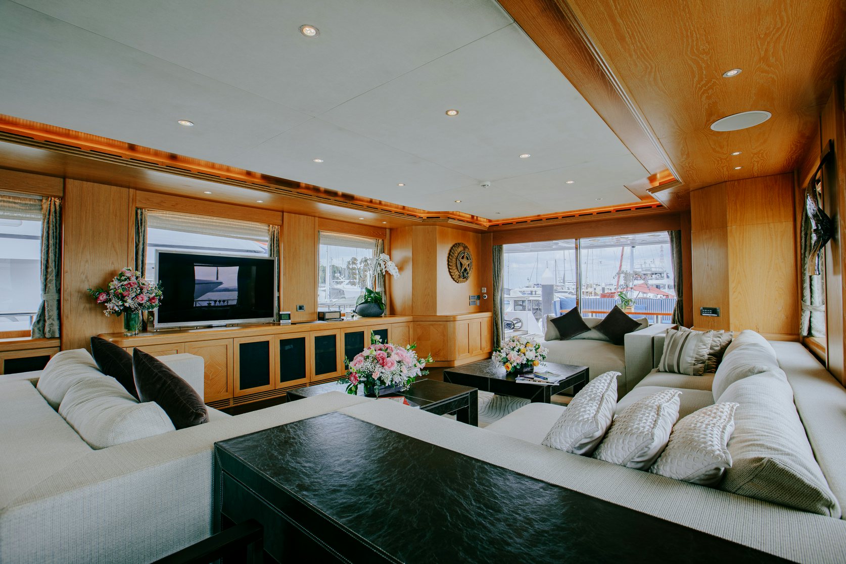a living room with a large sofa aboard INDIANA Yacht for Charter