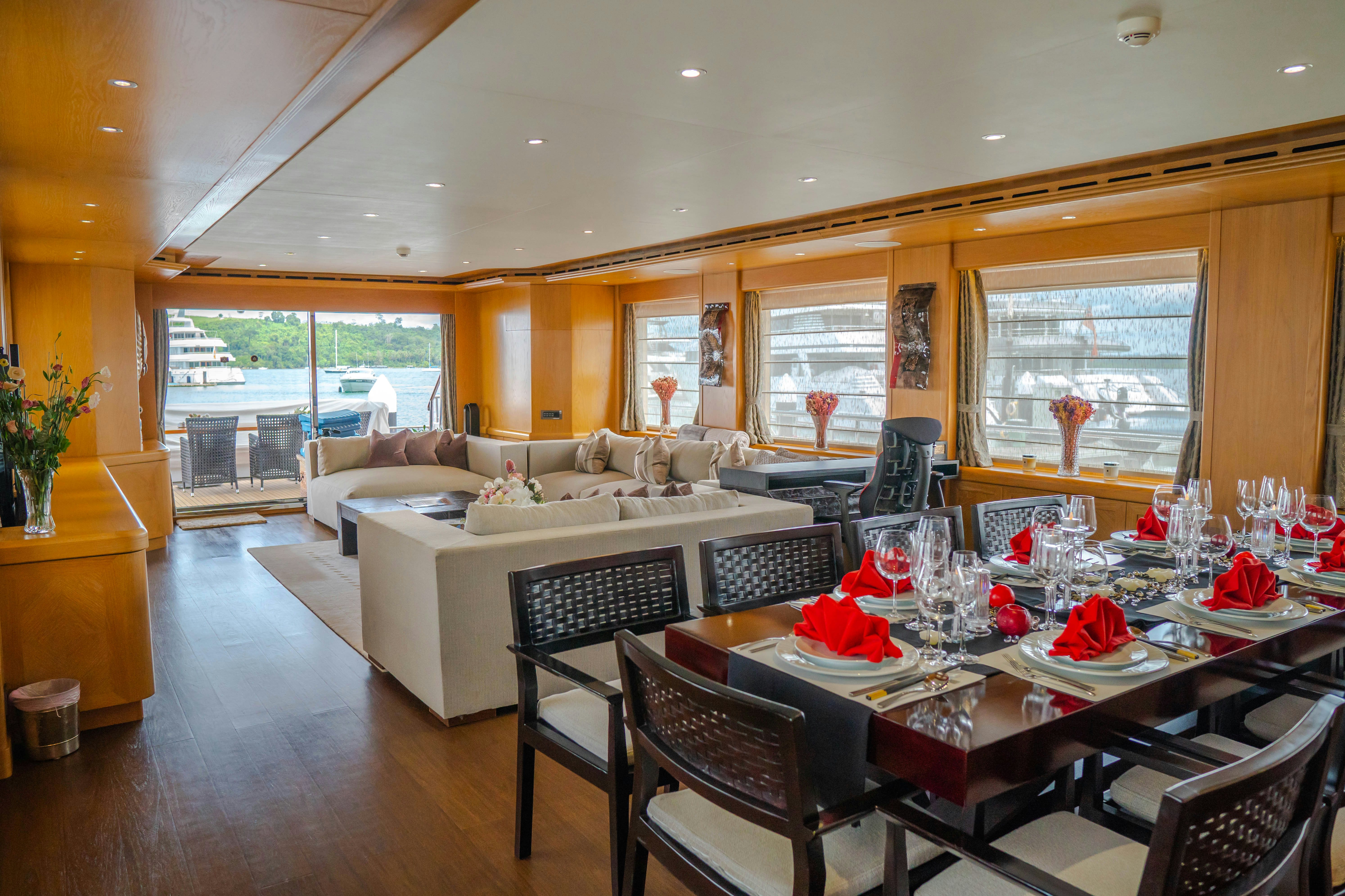 a large dining room with a large table and chairs aboard INDIANA Yacht for Charter