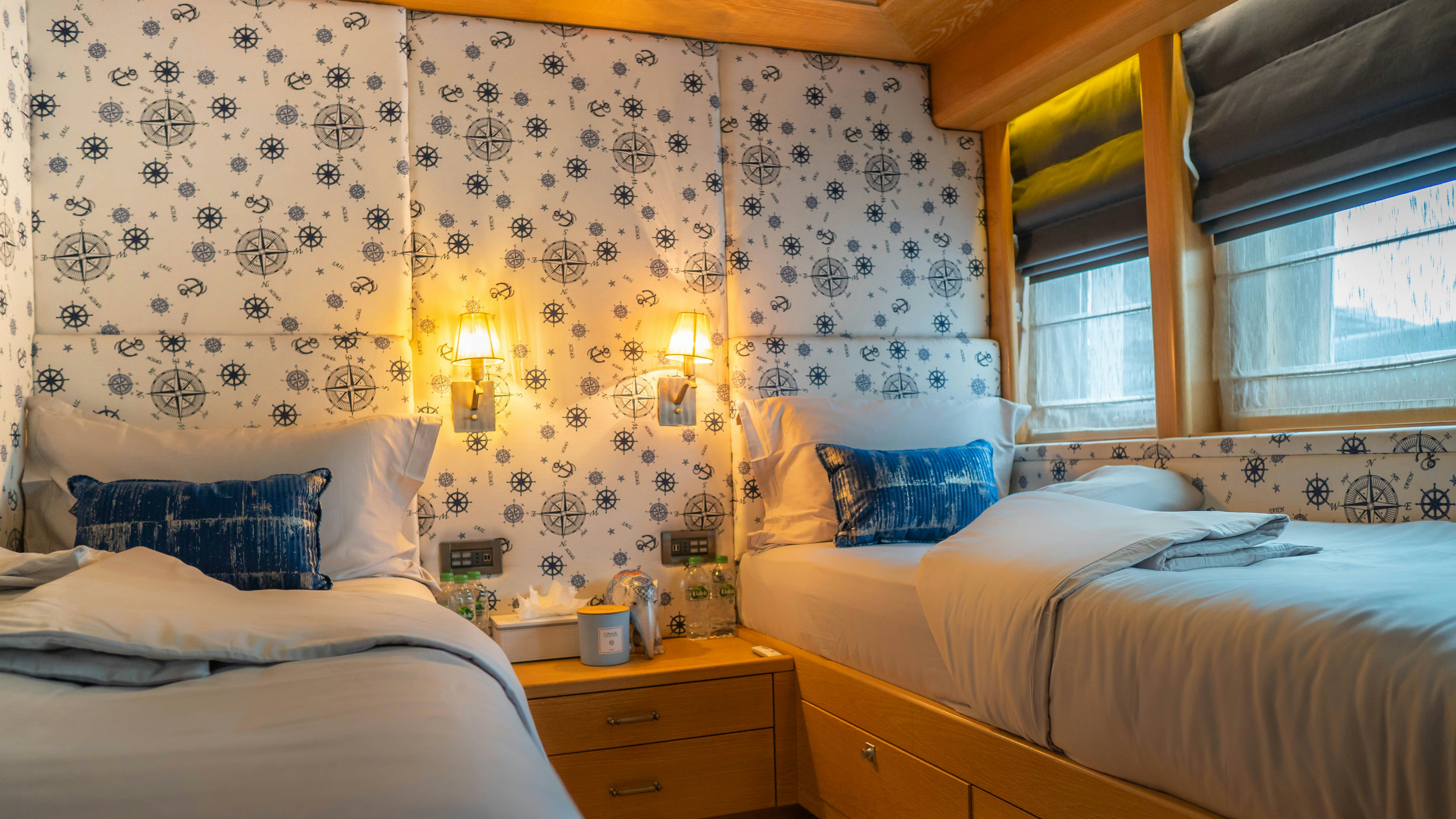 a room with two beds aboard INDIANA Yacht for Charter