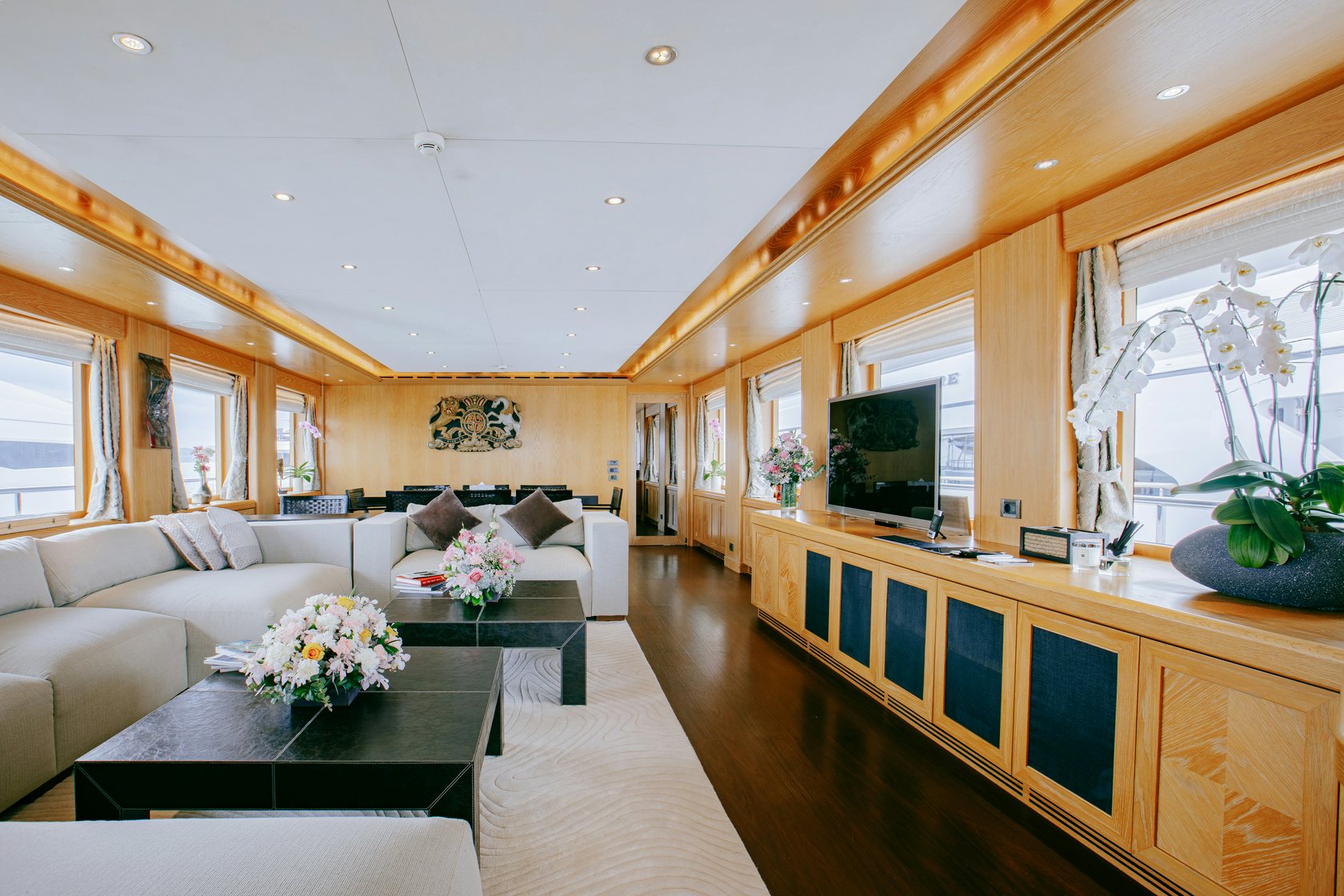 a living room with a large window aboard INDIANA Yacht for Charter