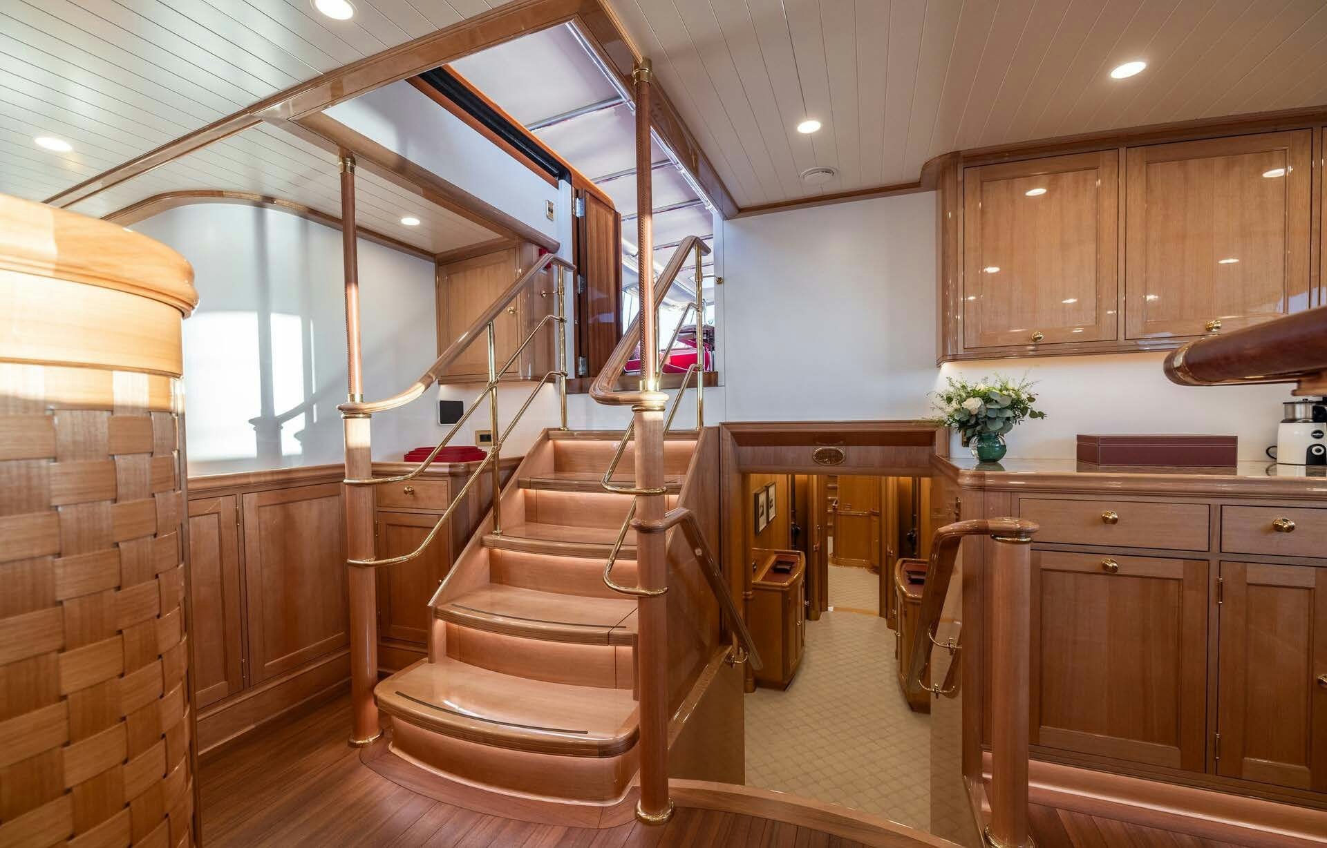 a wooden staircase in a house aboard MAXIMUS Yacht for Charter