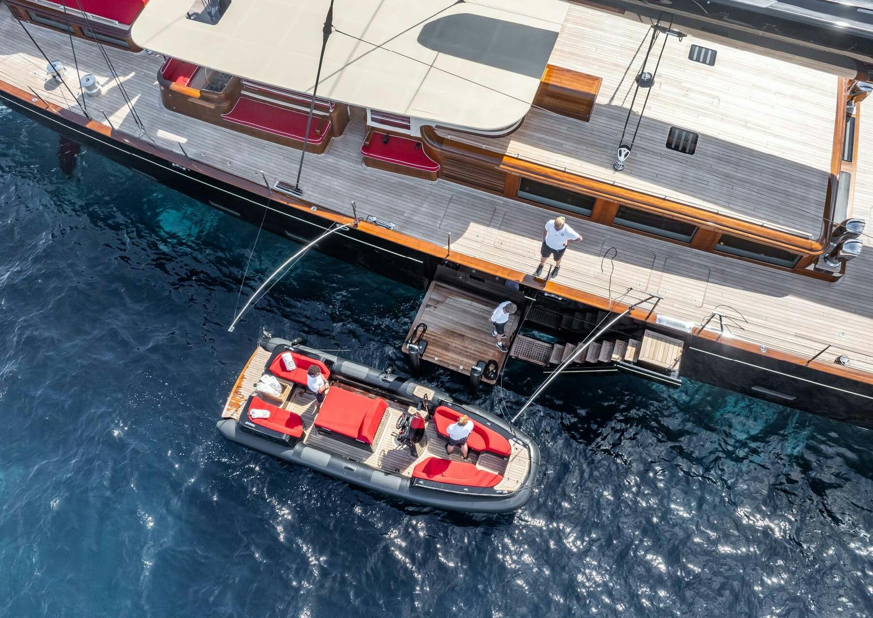 a boat is sailing on the water aboard MAXIMUS Yacht for Charter
