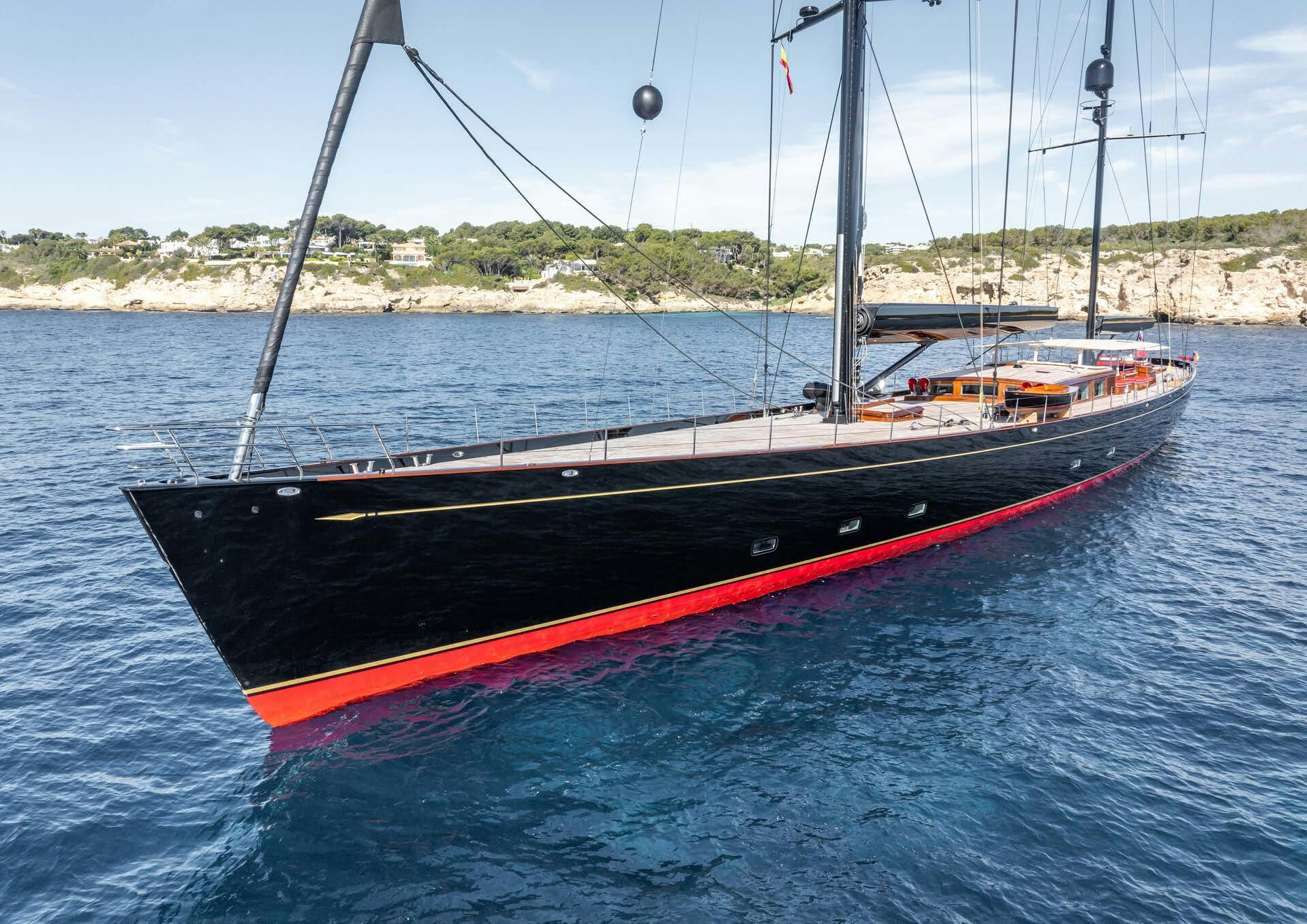 a red and black boat on water aboard MAXIMUS Yacht for Charter