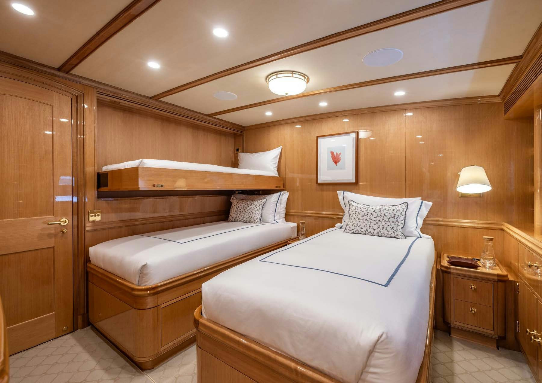 a room with two beds aboard MAXIMUS Yacht for Charter