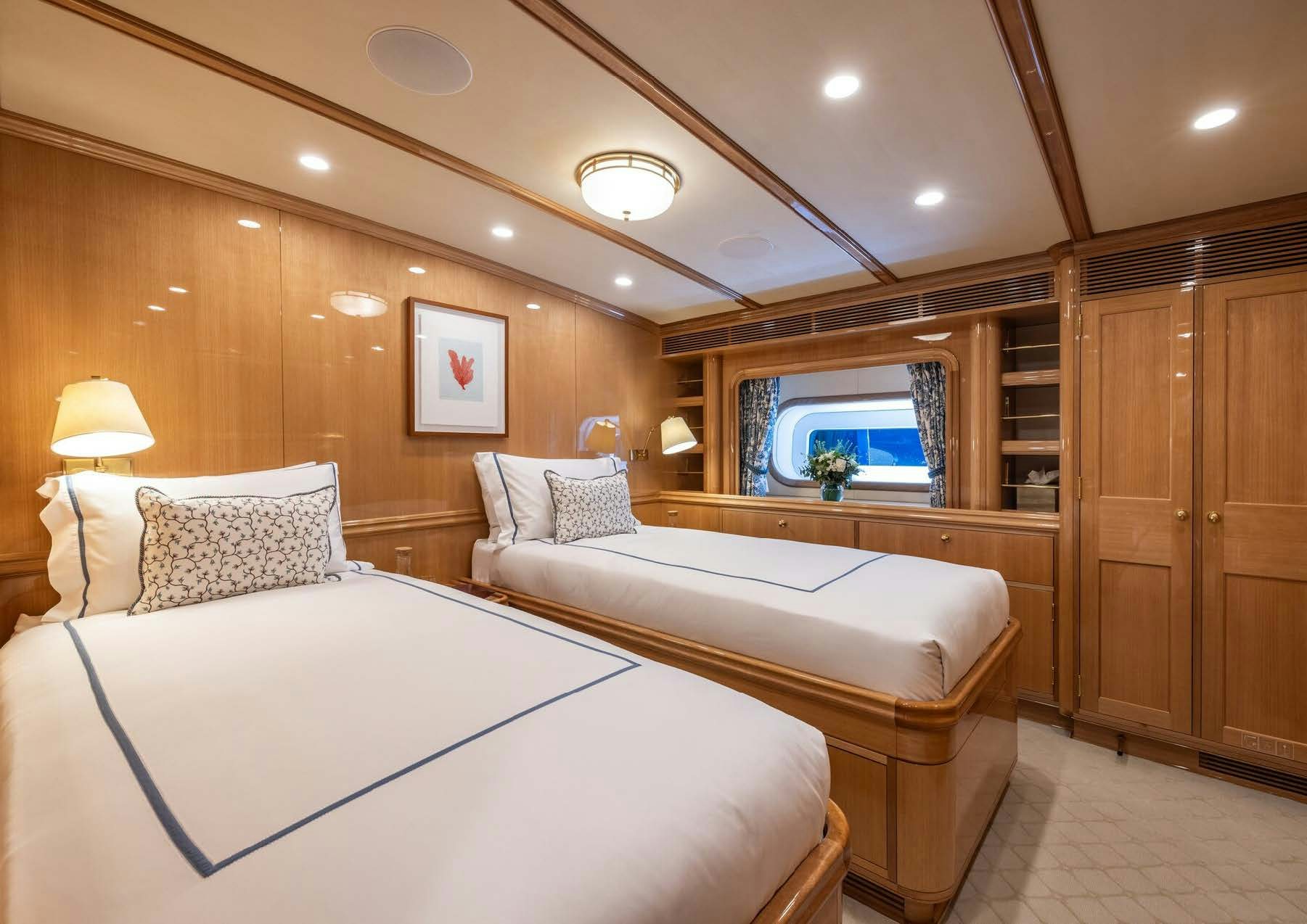 a room with a bed and a desk aboard MAXIMUS Yacht for Charter