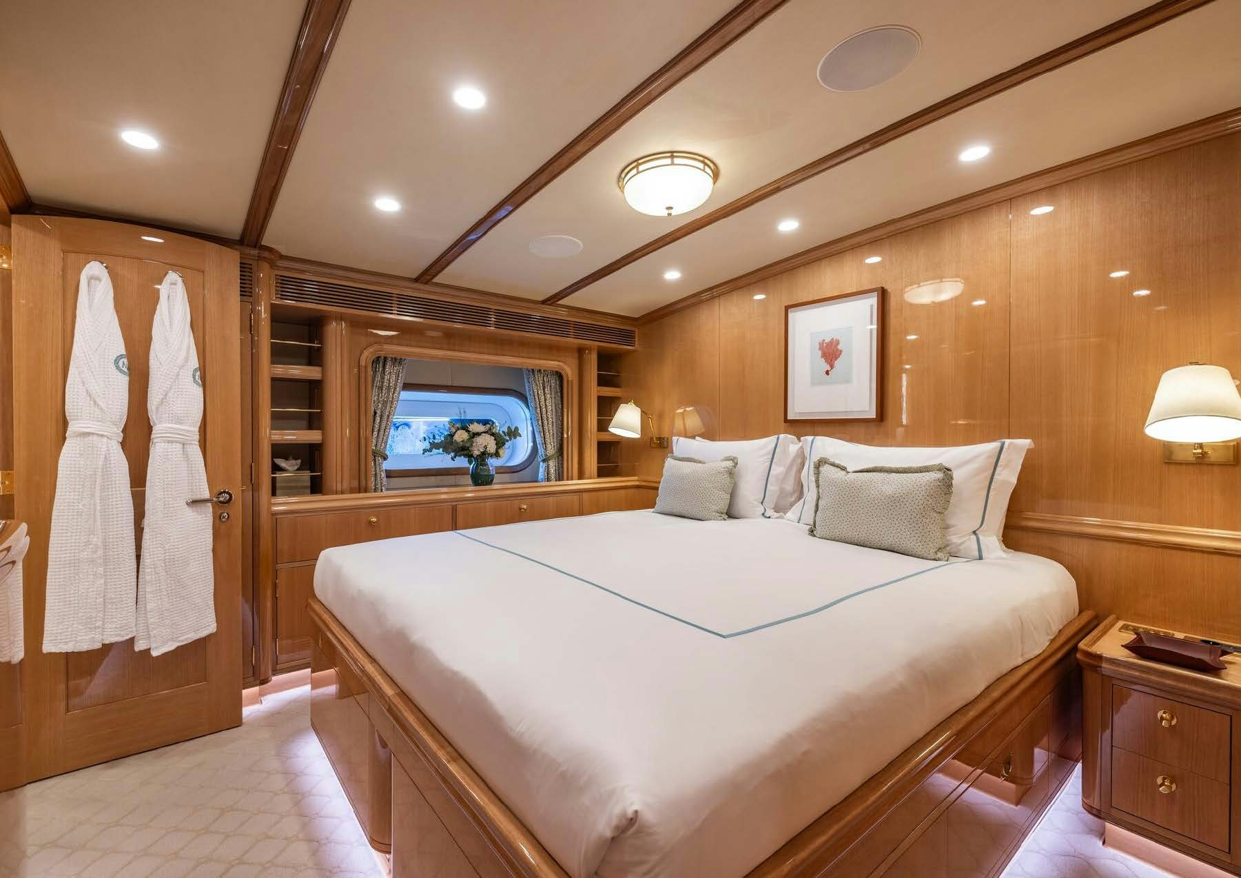 a bedroom with a large bed aboard MAXIMUS Yacht for Charter