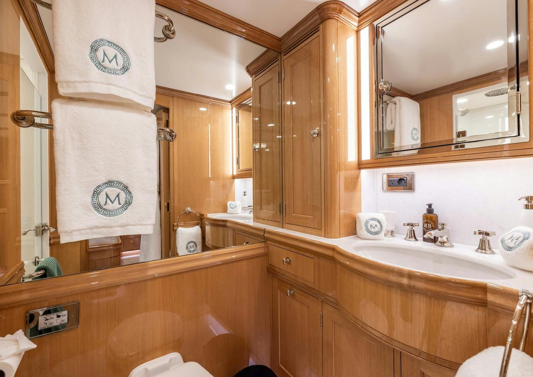 a bathroom with a large mirror aboard MAXIMUS Yacht for Charter